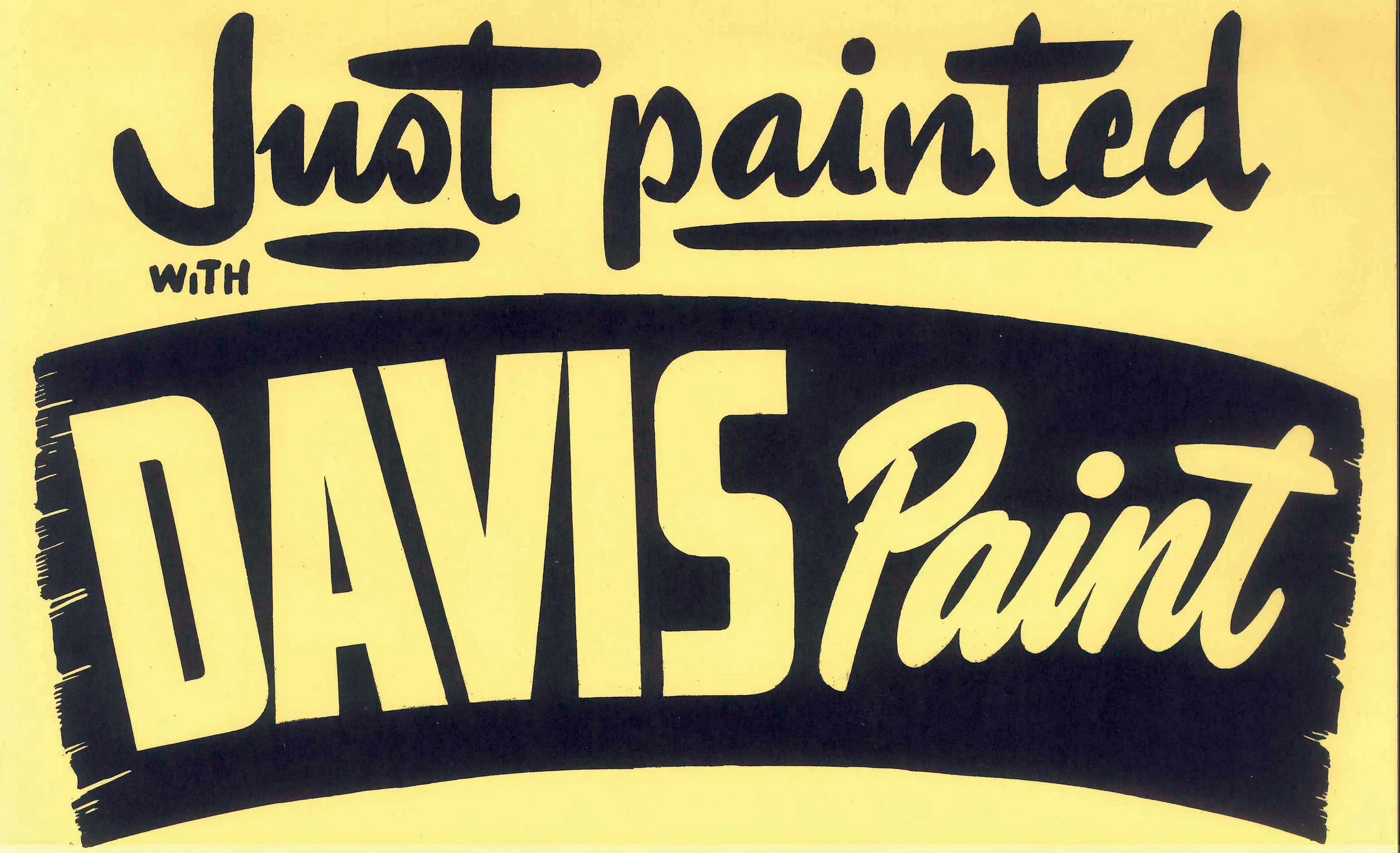 Hand-drawn sign with the message "Just painted with DRIVE" on yellow paper, using black marker with decorative and bold lettering.