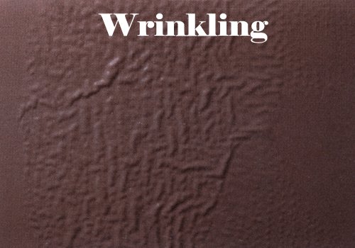 Close-up of a textured brown wall with the word 'Wrinkling' written at the top.
