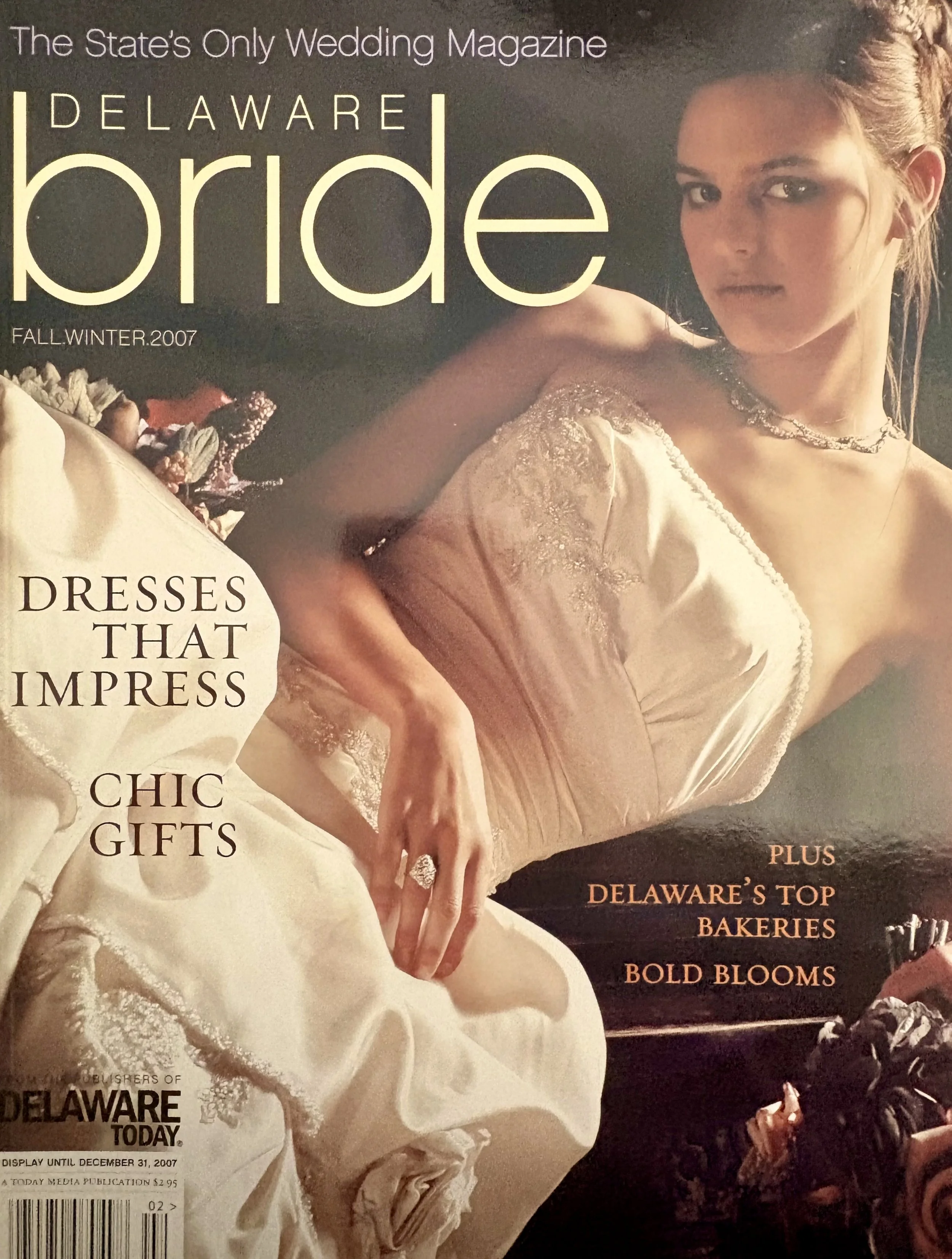 Magazine cover titled 'Delaware Bride' with a photo of a woman in a wedding dress, looking at the camera, with text highlighting wedding dresses, gifts, bakeries, and blooms, dated Fall/Winter 2007.