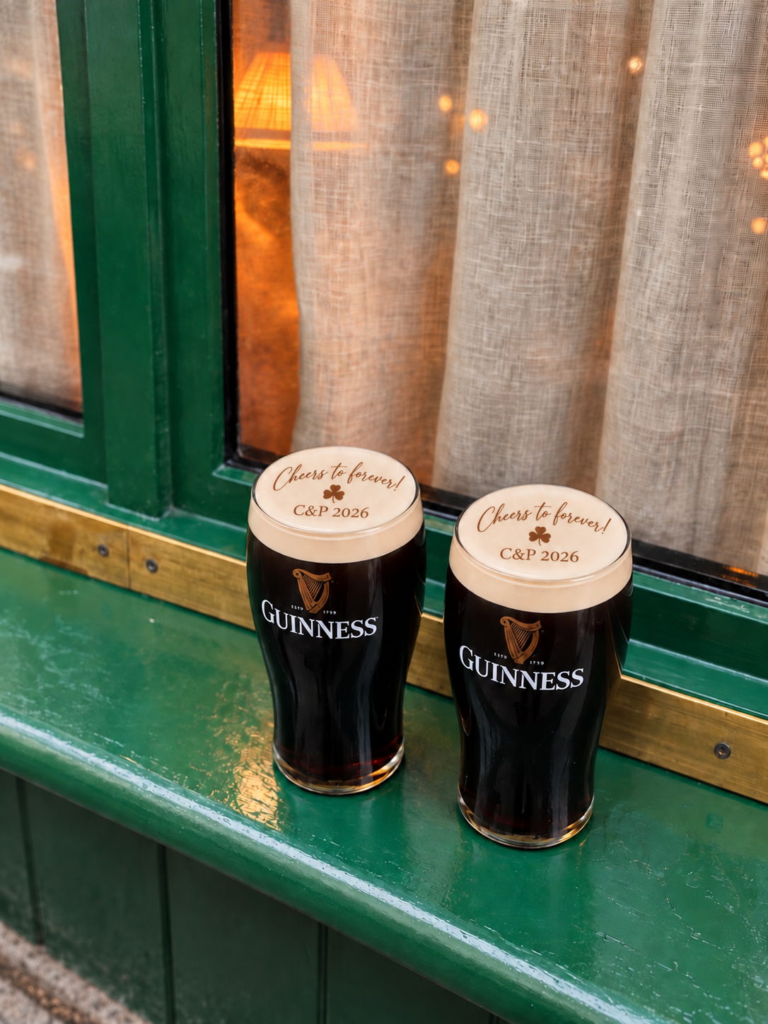 Two personalised stout pints with wedding foam designs