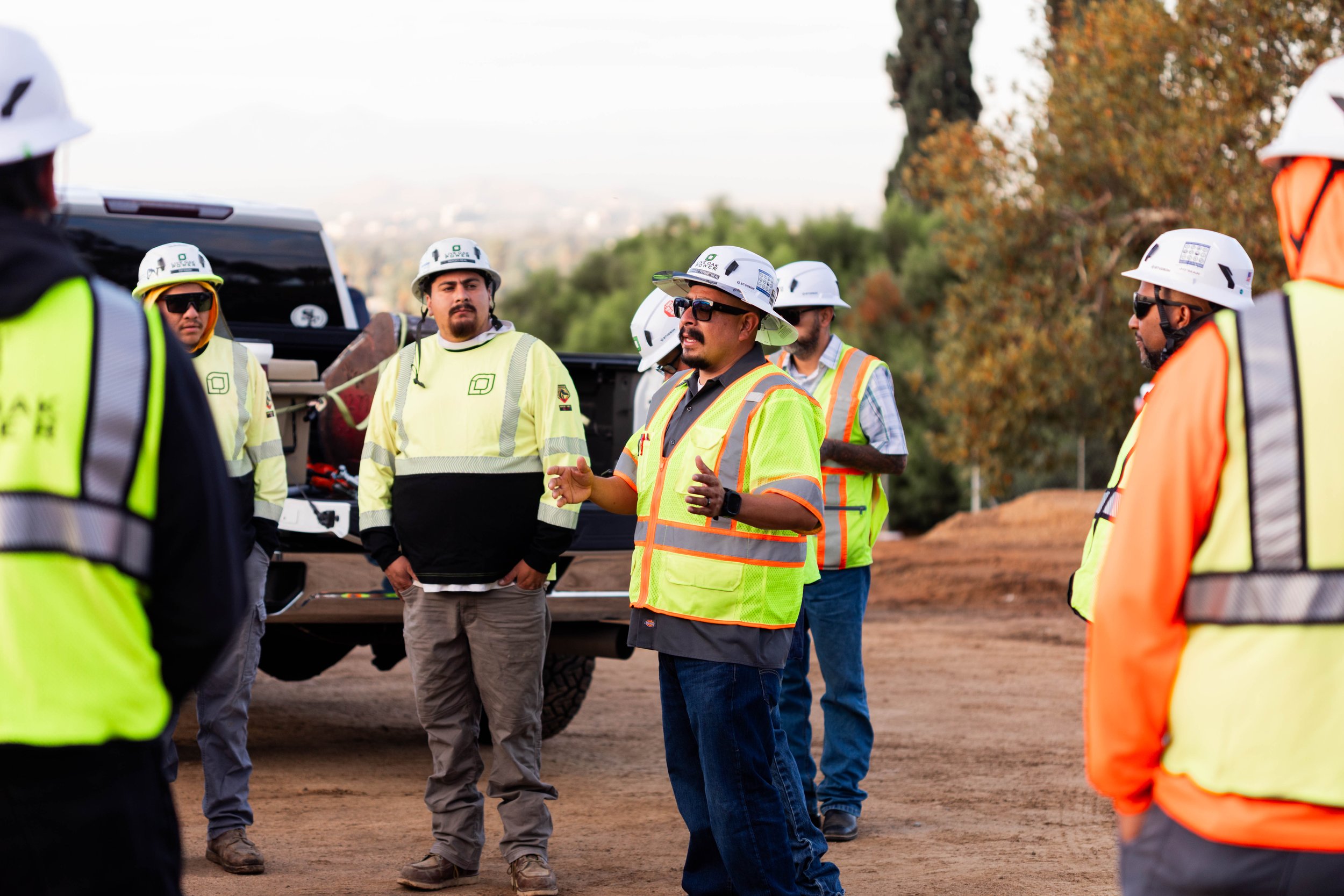 Crew holding a daily tailgate safety meeting before work begins.