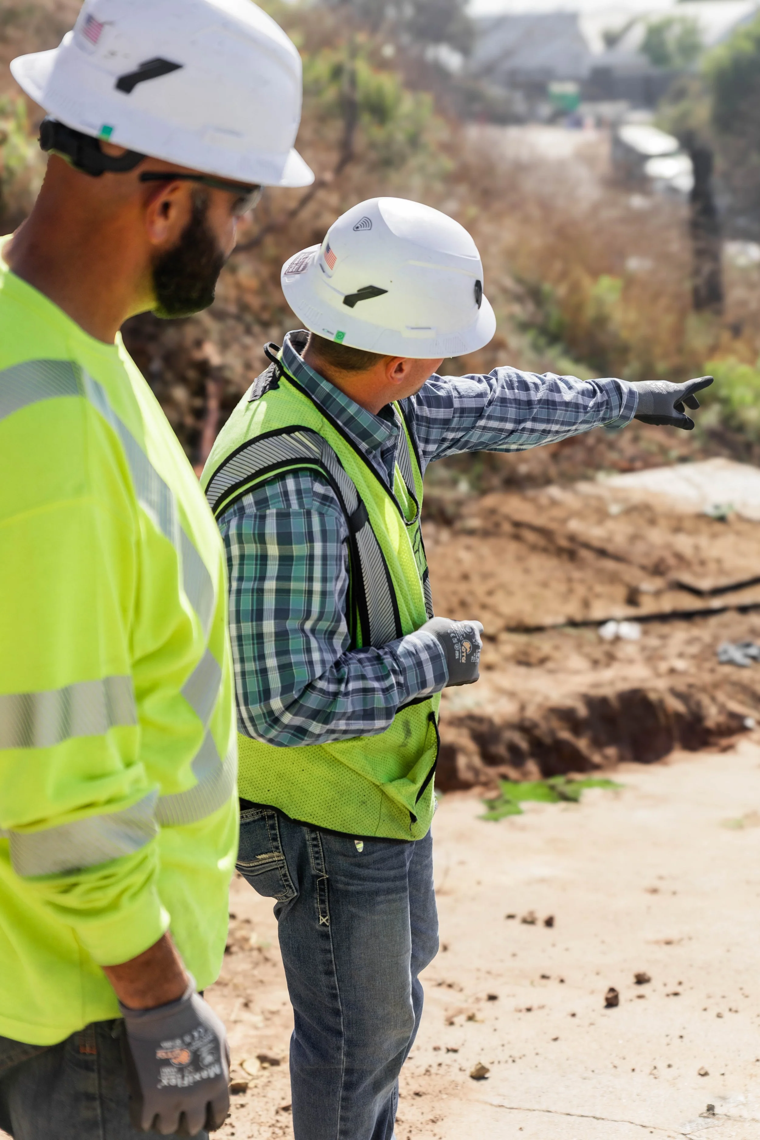 Field leader directing work at a jobsite.