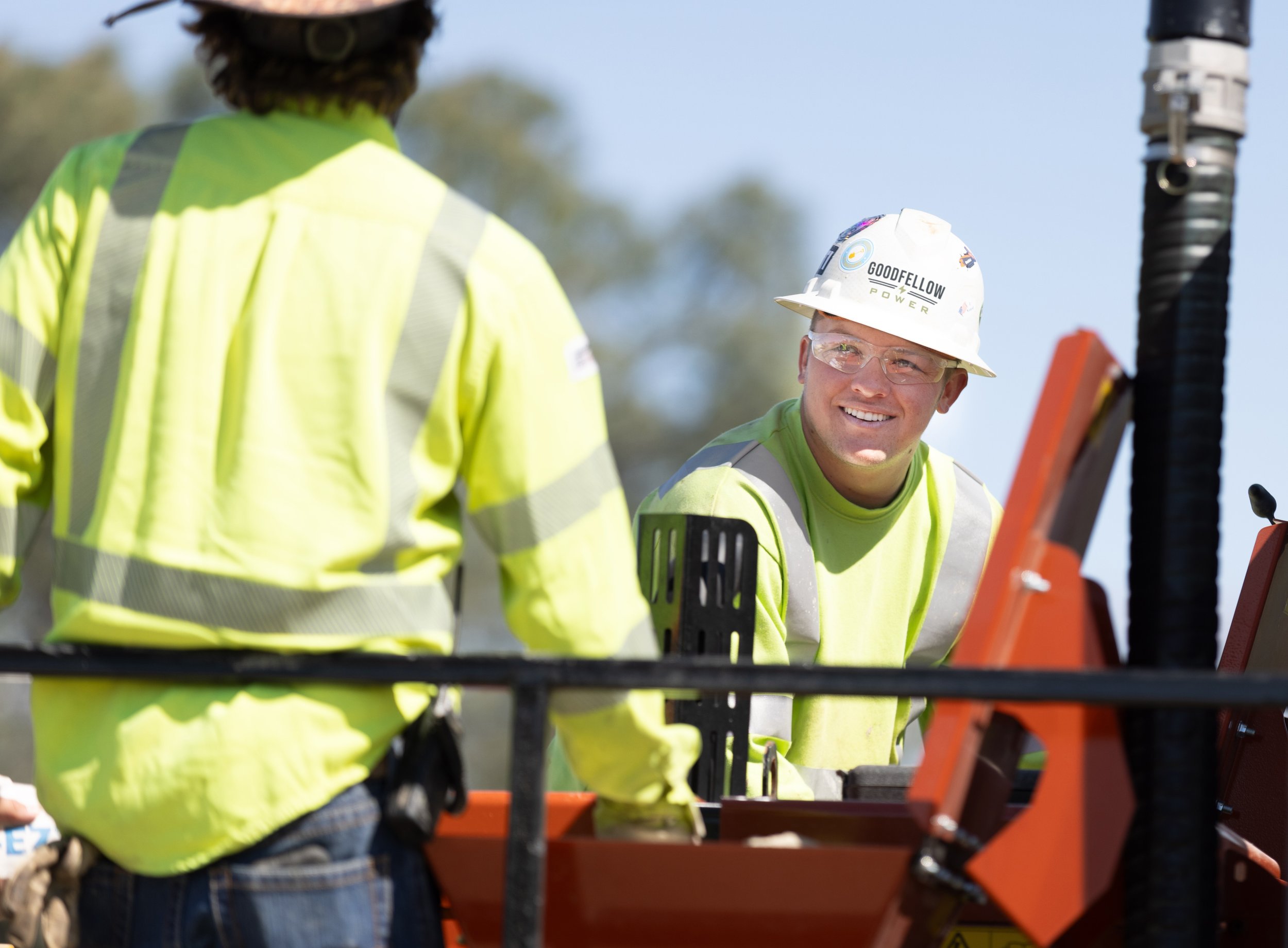 Crew operating heavy equipment during underground utility work.