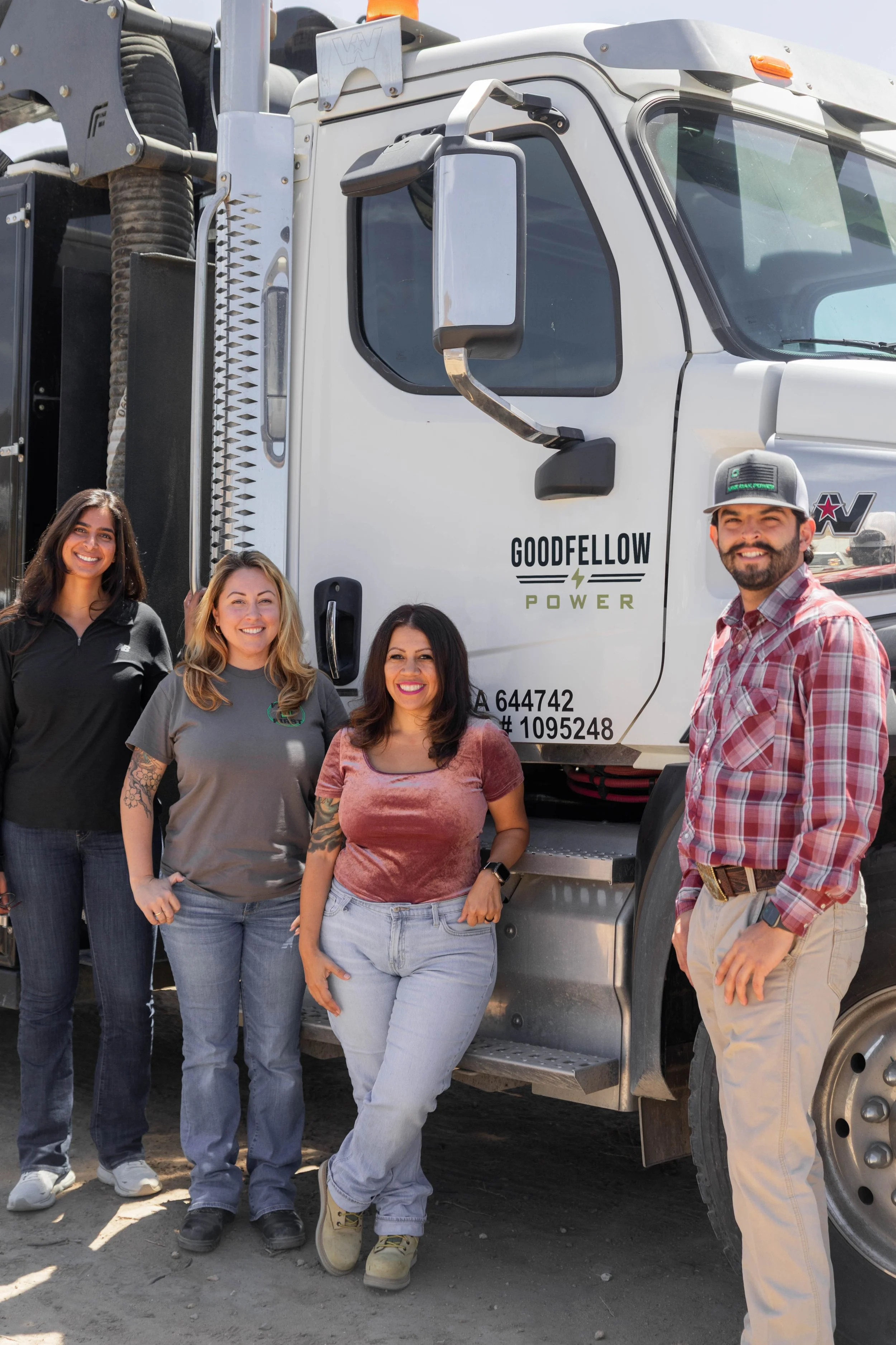 Goodfellow Power team in front of a company truck.