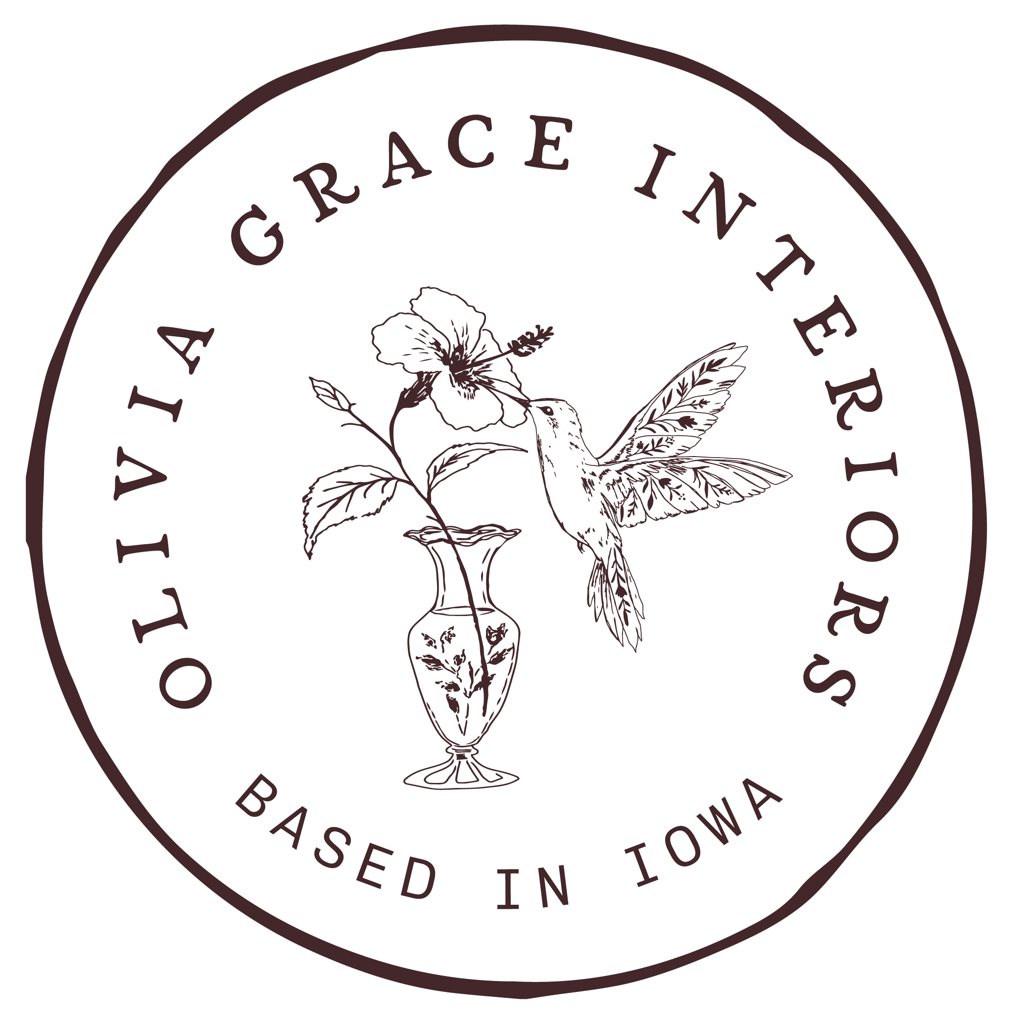 Close-up of a circular logo featuring a botanical illustration of a flower with leaves and a stem, along with the text "GRAEACEAE" and additional small text around the circle.