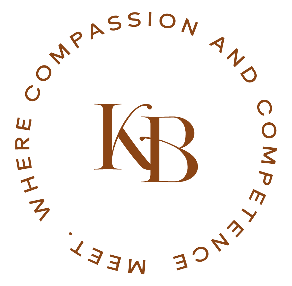 Brown logo with the text "Compassion and Competition" encircling the initials "KB" in the center.