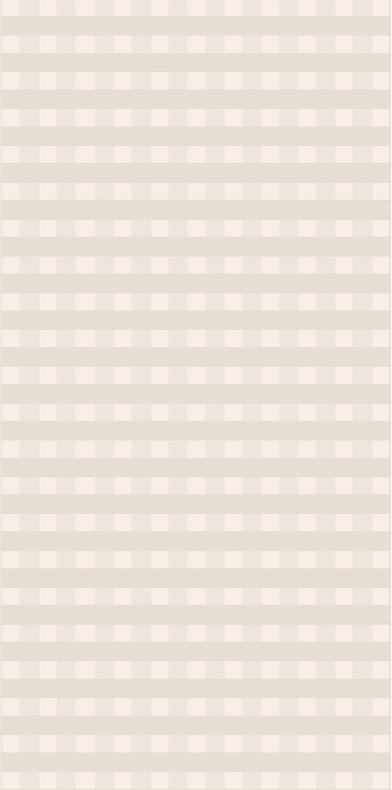 A beige and white striped curtain with a window behind it.