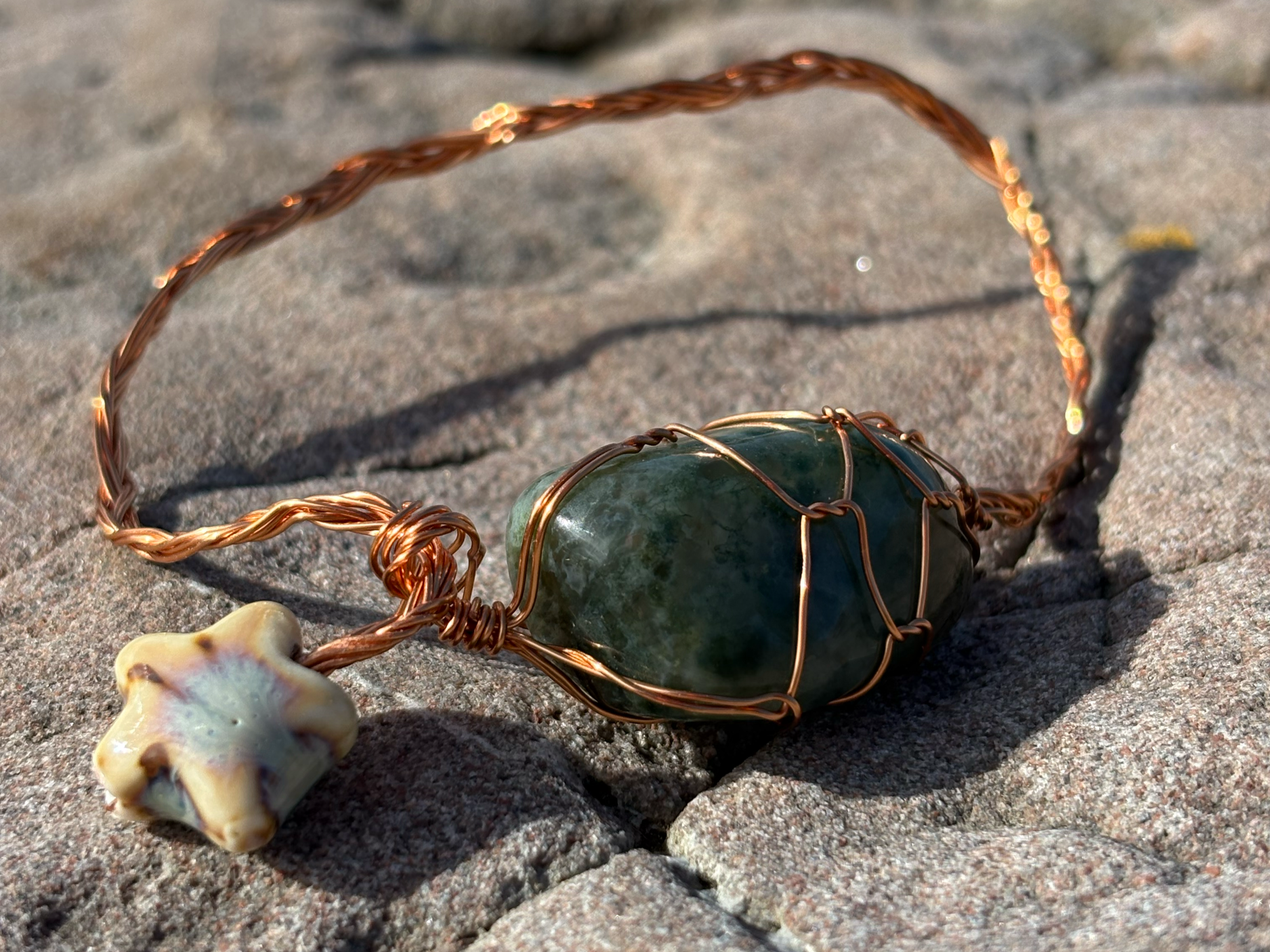 Blob. 

The one that started it all. 
Copper wire, semi precious gem of some sort, ceramic star.

£22