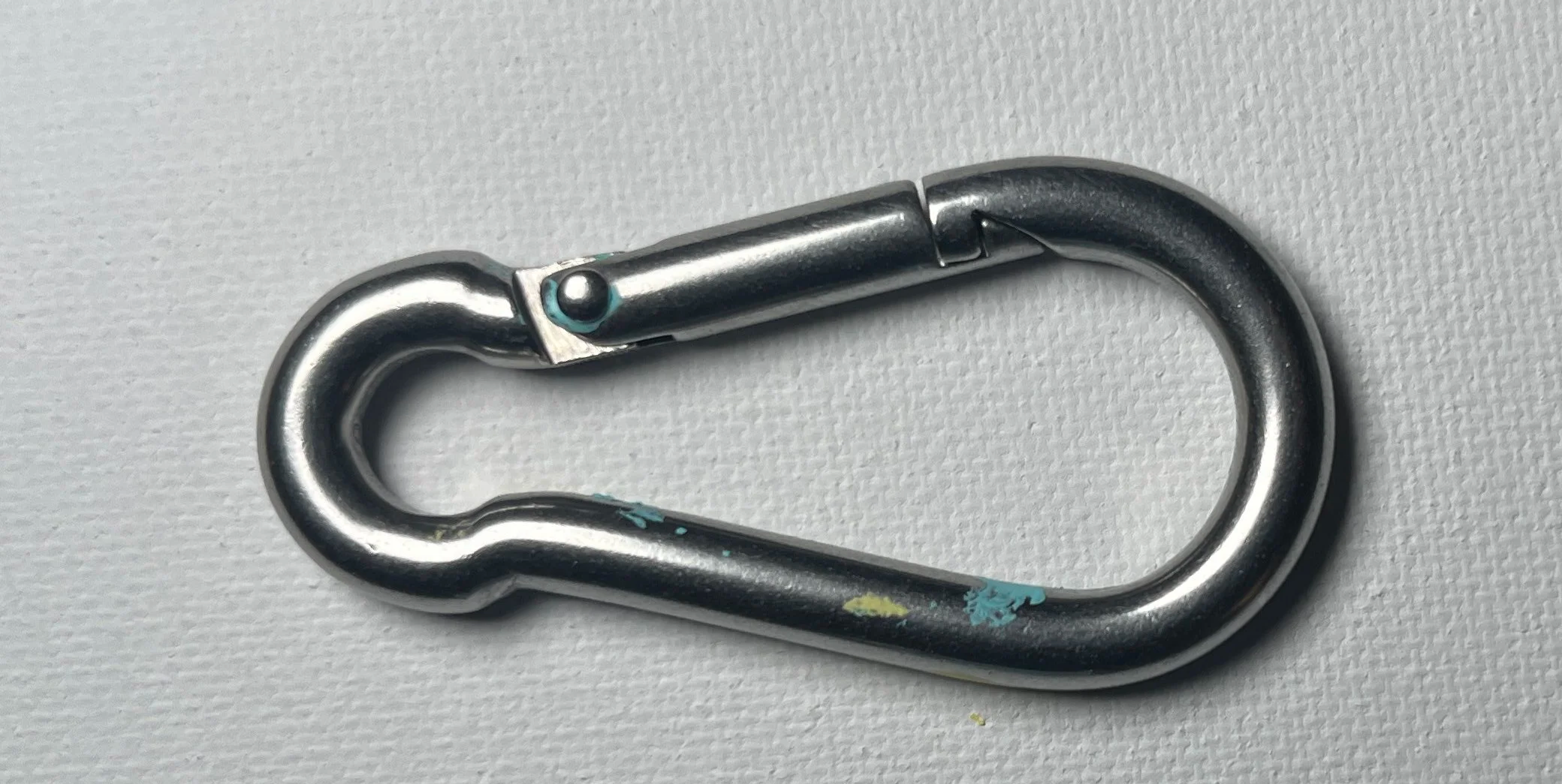 Carabiner used as a quick connector for adjusting Fred Pfeifer’s pendulum painting apparatus.