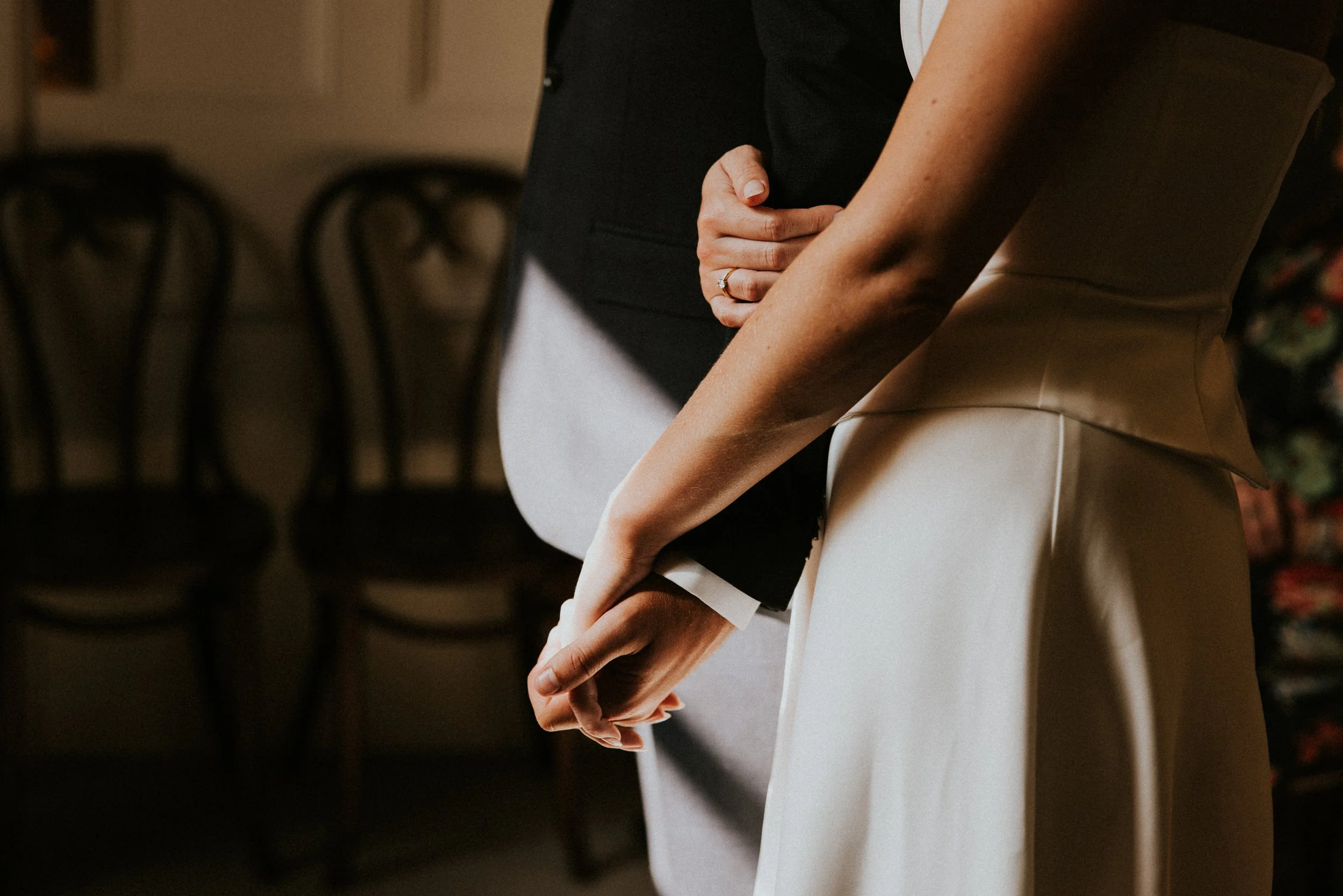 Candid moment of bride and groom holding hands, Somerset wedding - Josh Ward Creative