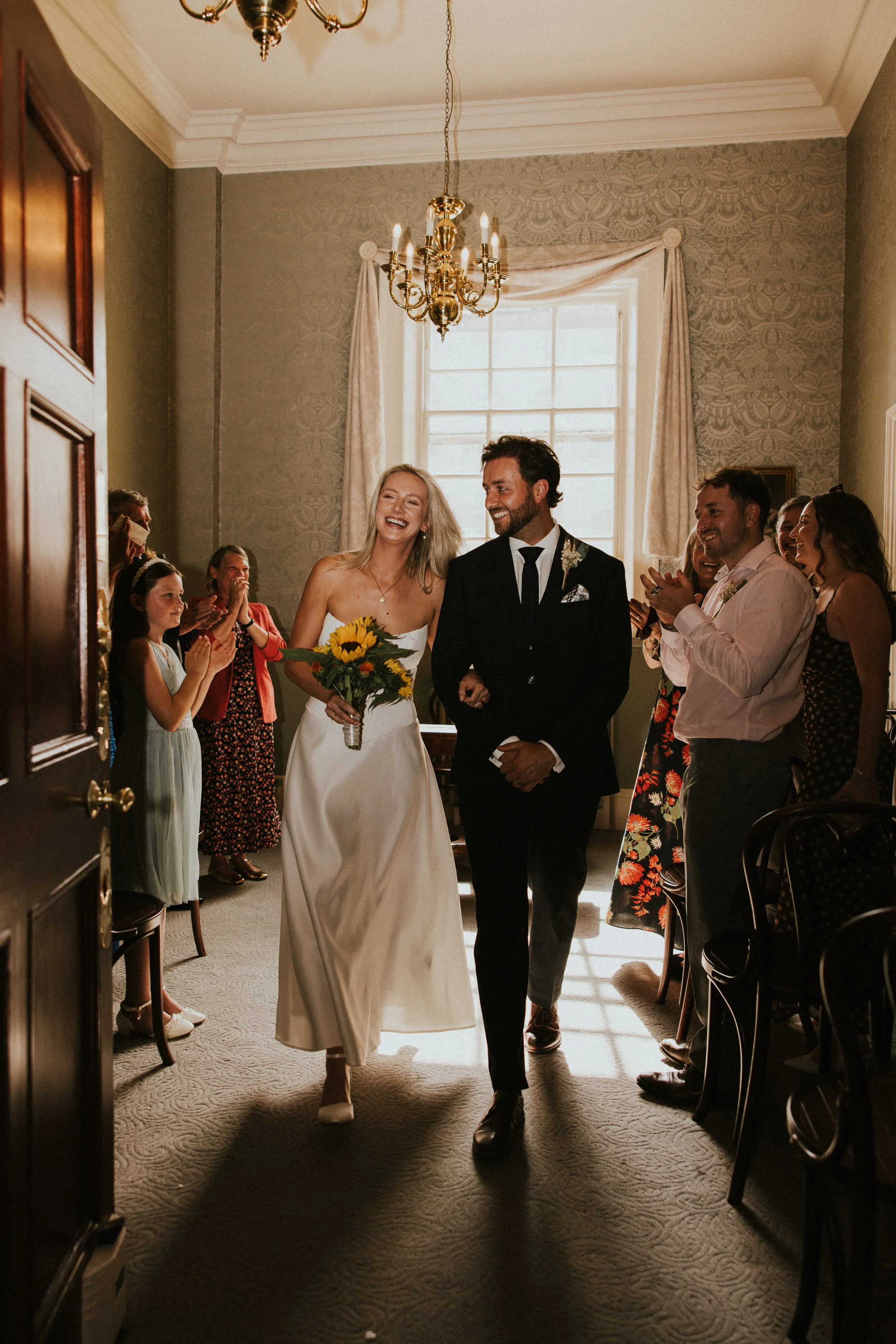 Indoor ceremony aisle exit celebration with guests, Somerset wedding - Josh Ward Creative