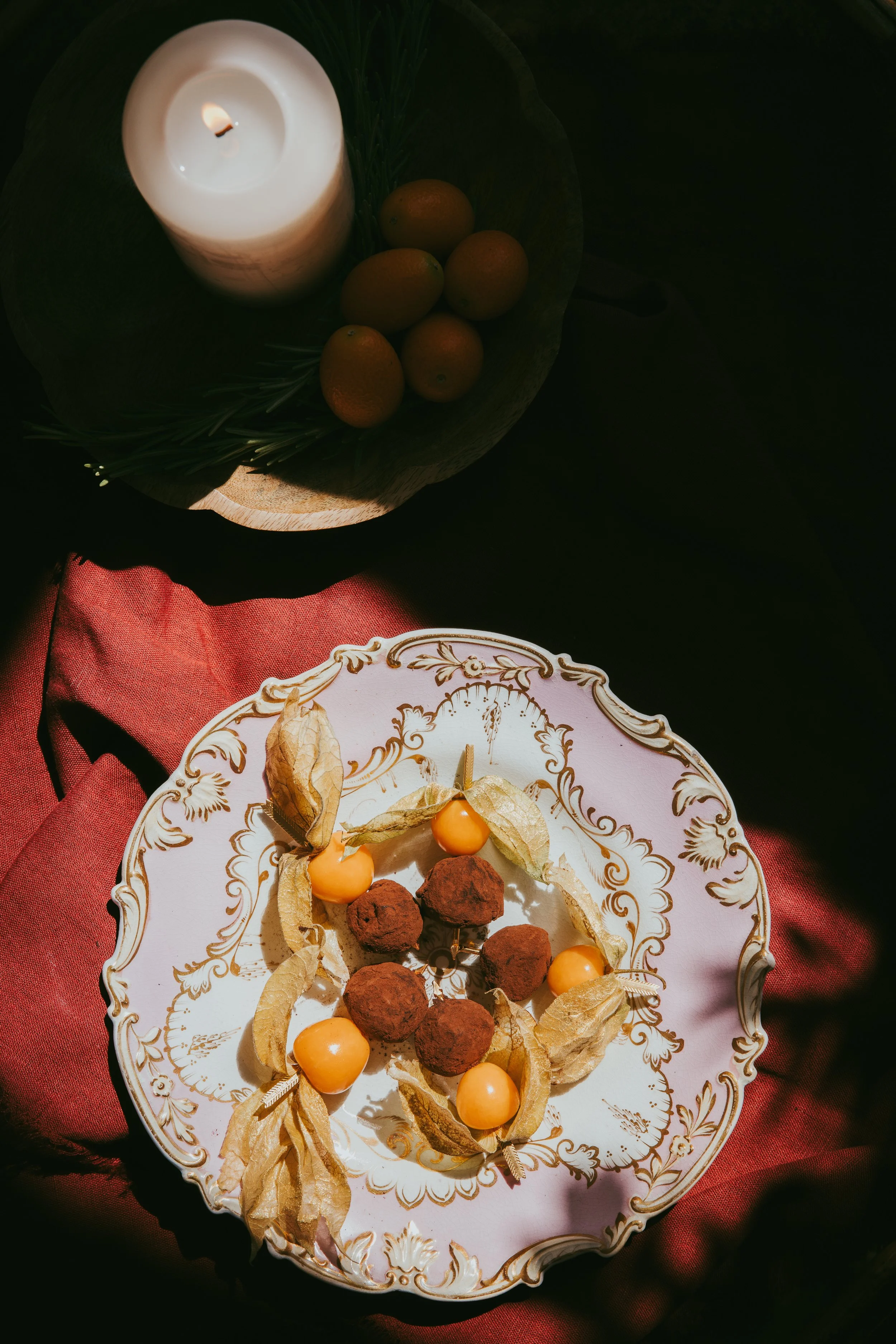 Artisan chocolate truffles with physalis fruit on vintage china - Josh Ward Creative