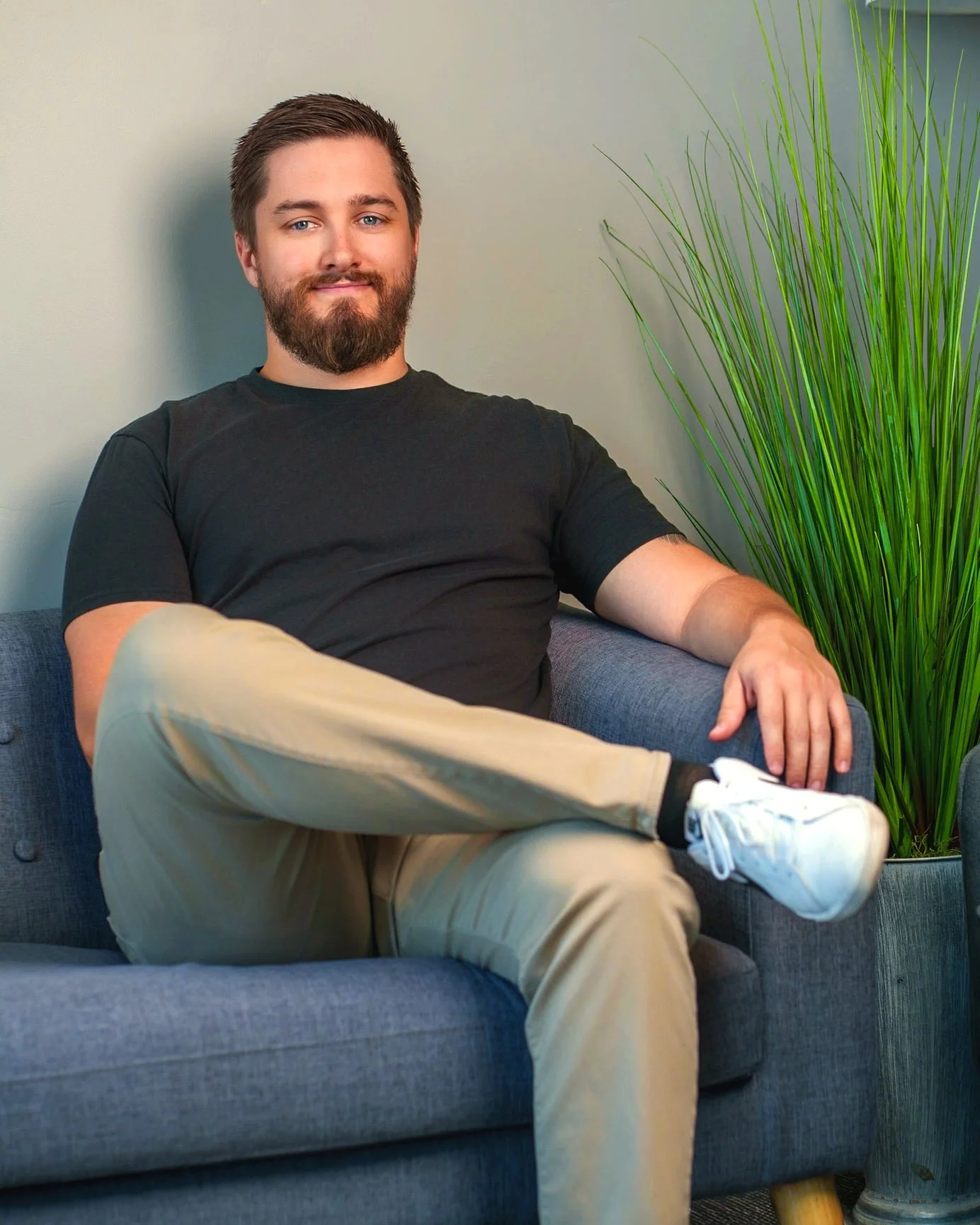 Utah therapist sitting in a chair.