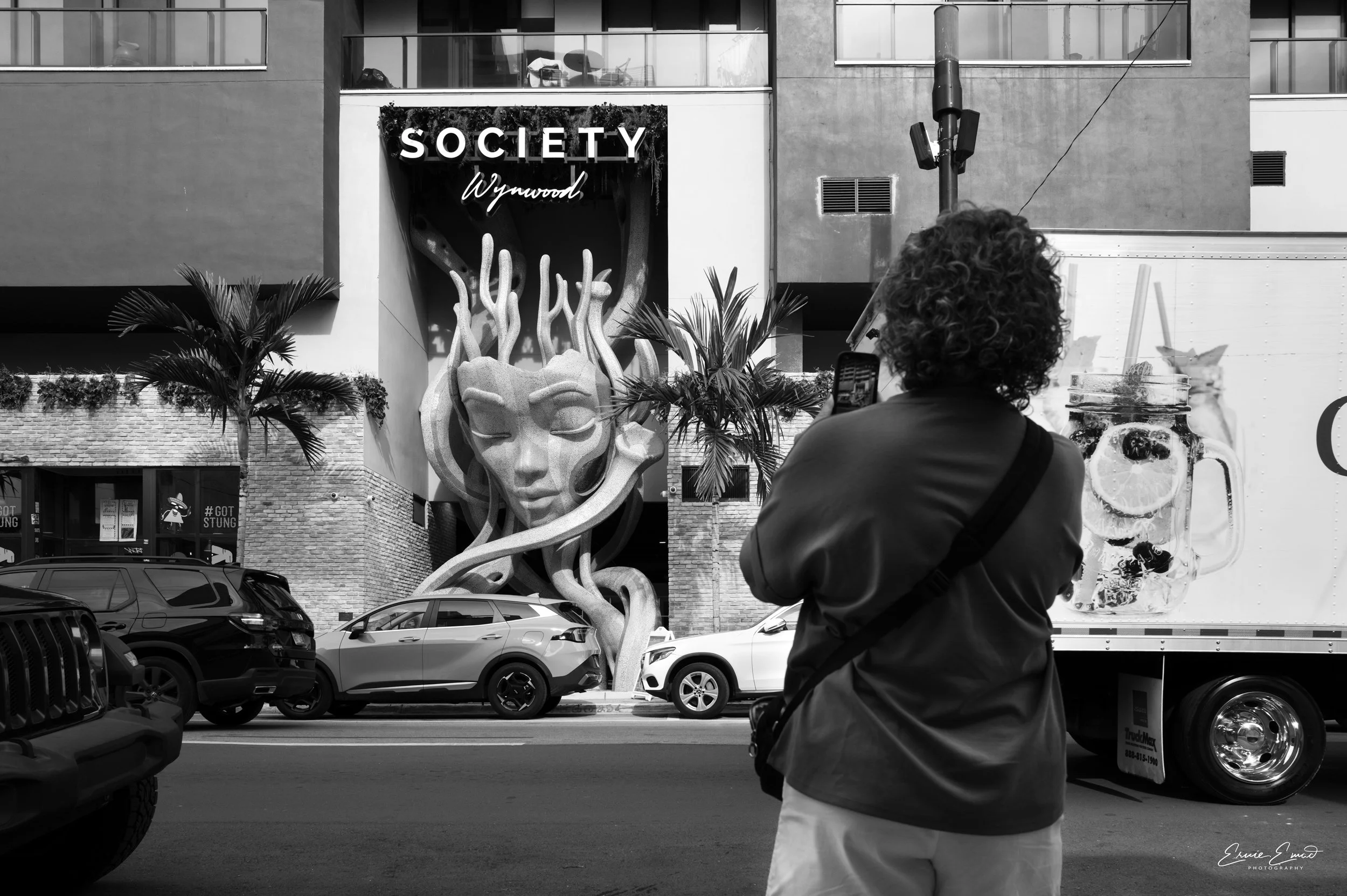 A tourist taking a picture of Society Wynwood