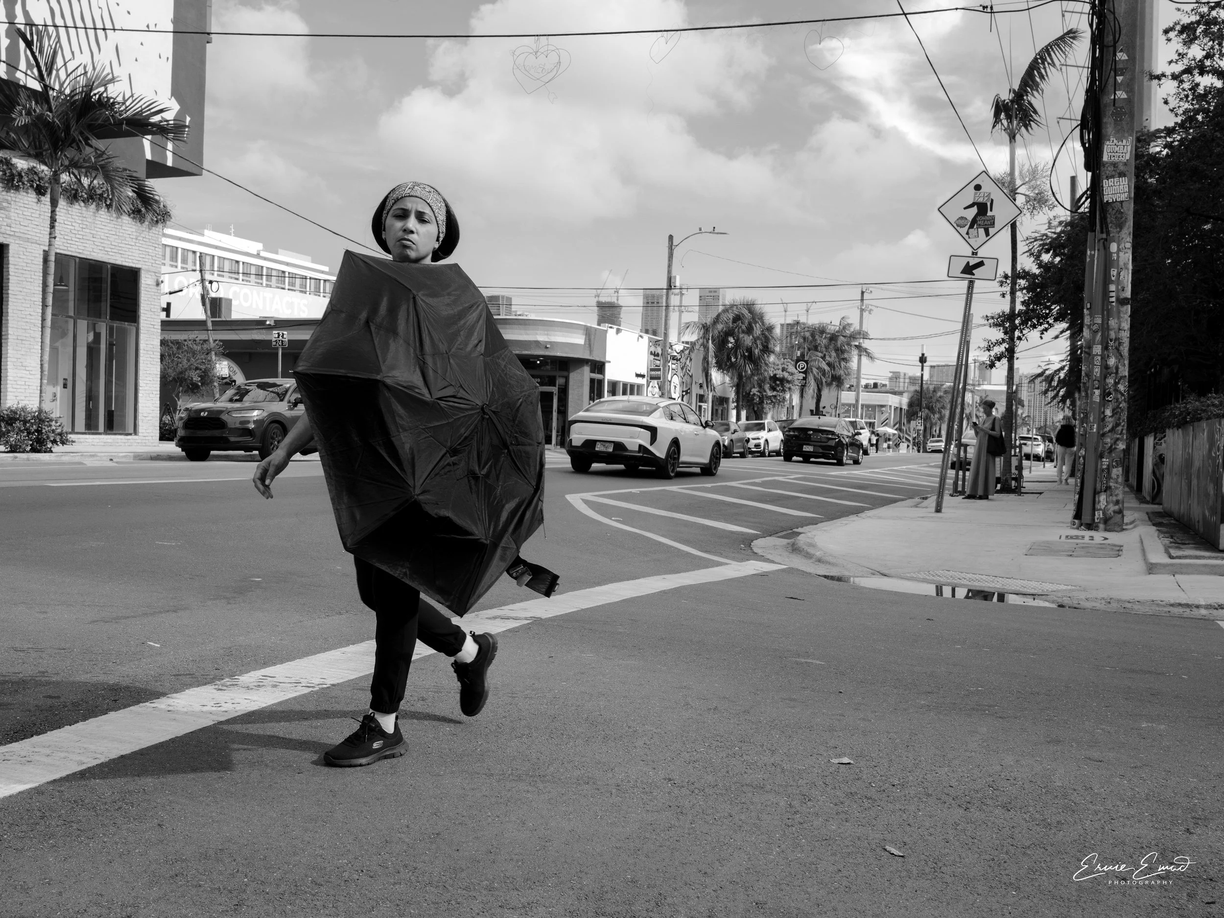Peaking through an umbrella on a hot summer day in wynwood miami