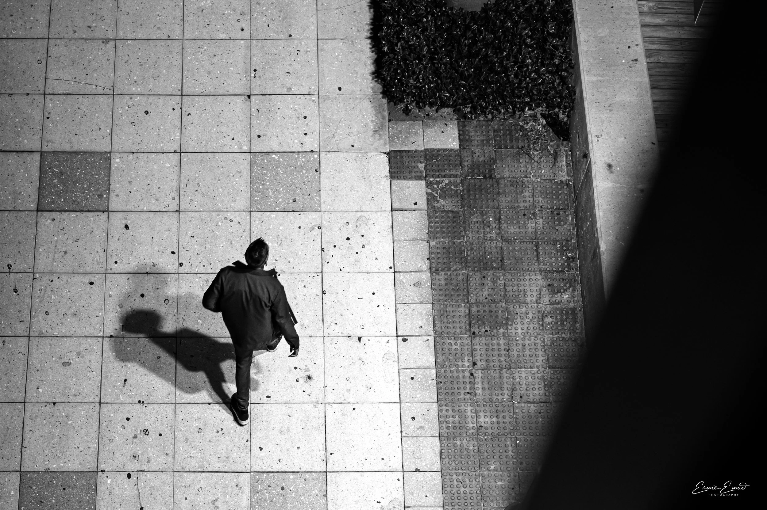 An Alien looking shadow of a person.  Light and Shadow at play from one of the bridges in Brickell along the Miami River