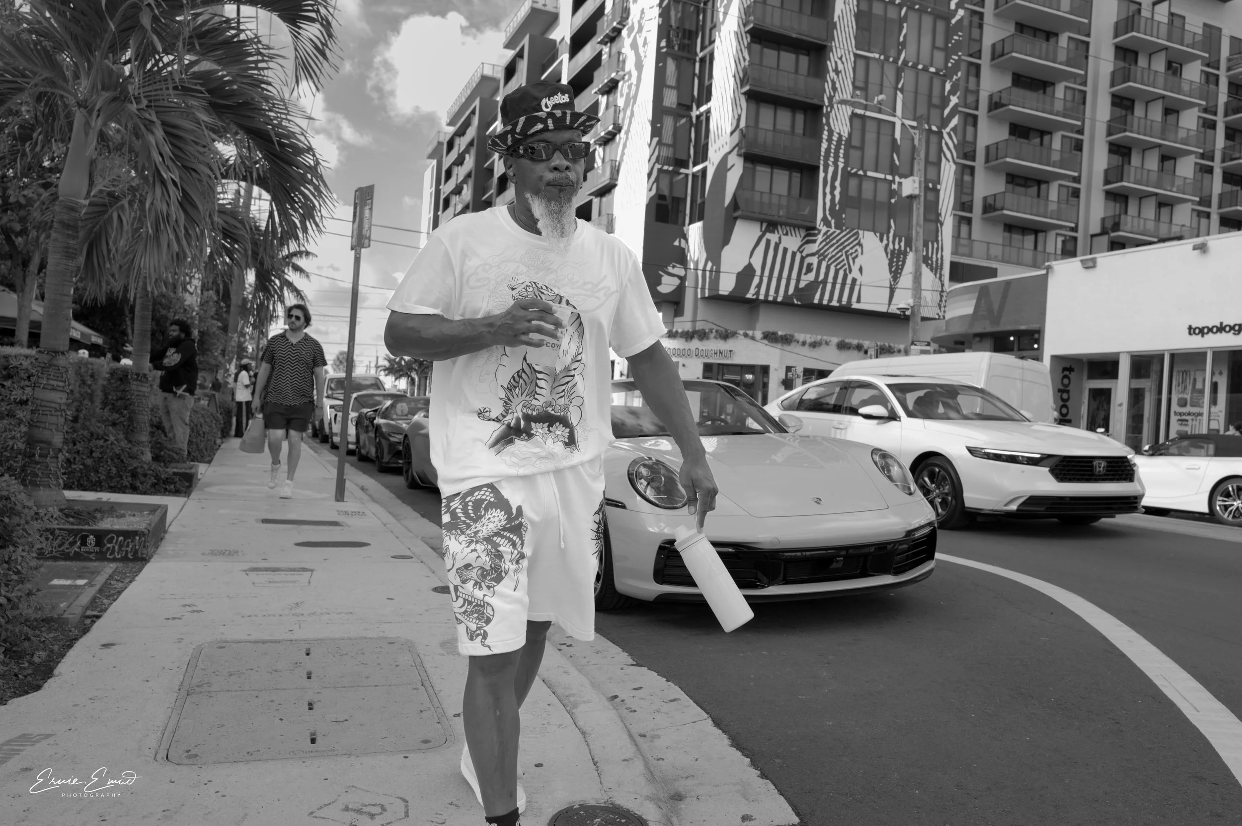 drink in hand with a place to go in Wynwood Miami