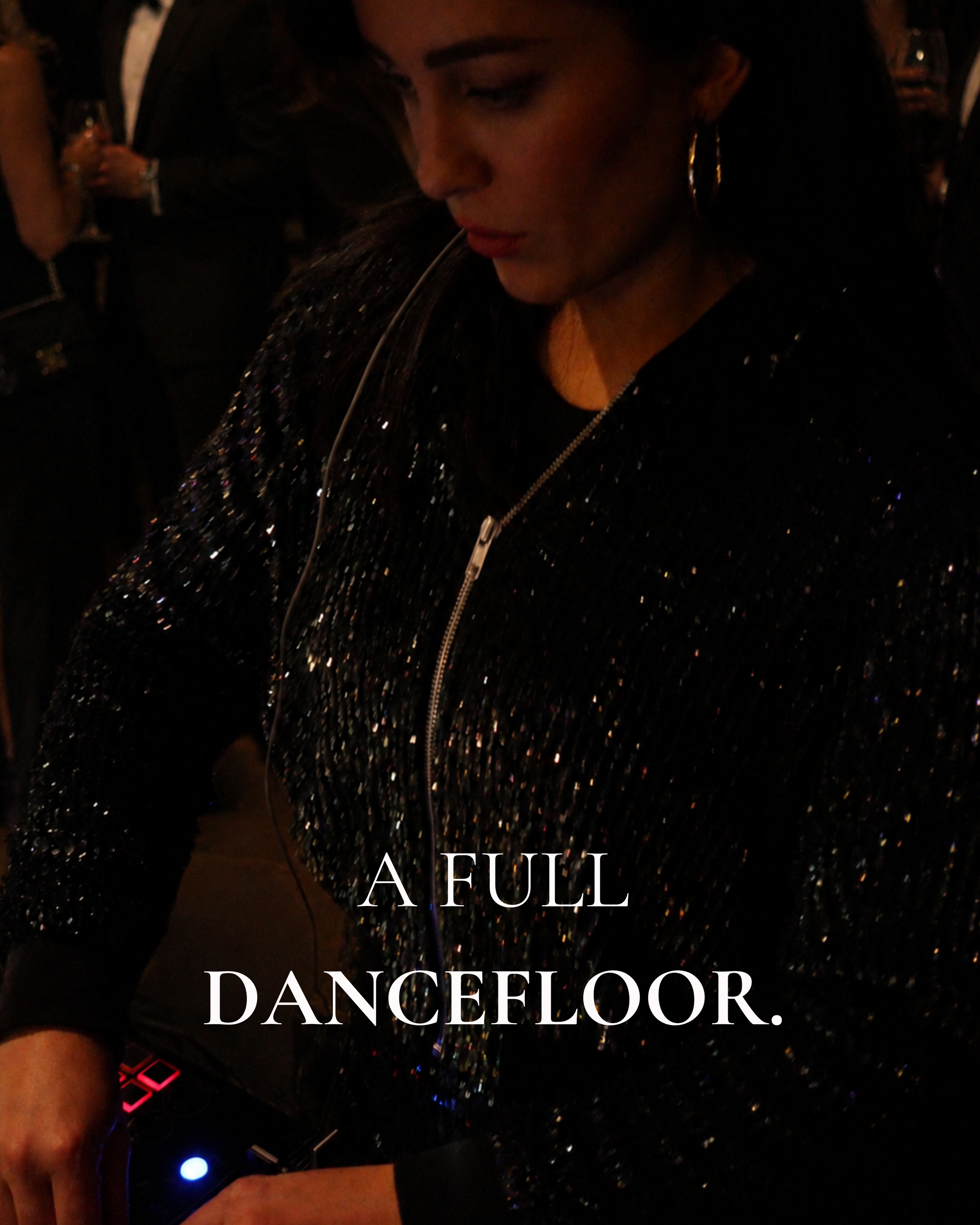 Natalie Ellen DJing at an evening wedding reception in London.