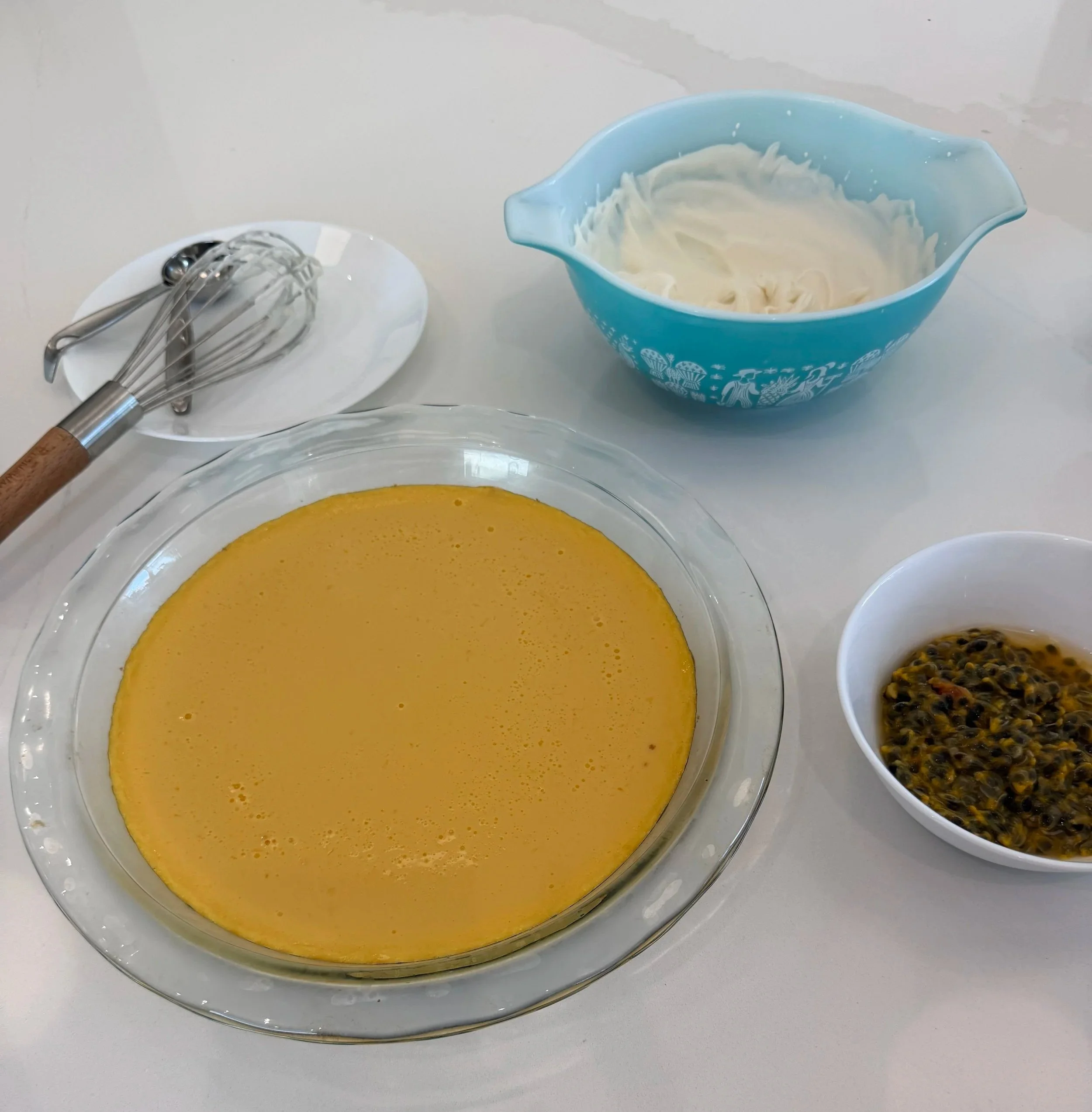 Homemade passionfruit pie with whipped cream and fresh passionfruit
