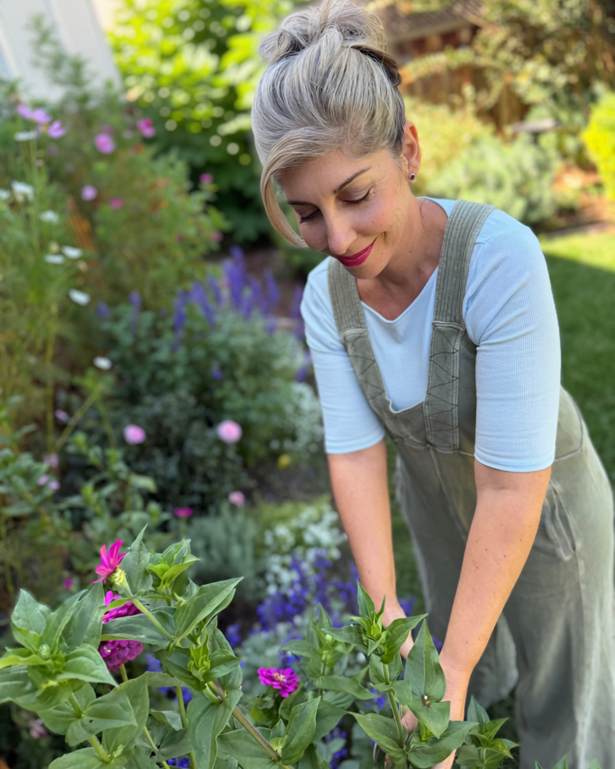 Liz tending flowers in her garden