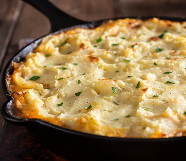 Golden-brown shepherd's pie baked in a cast-iron skillet