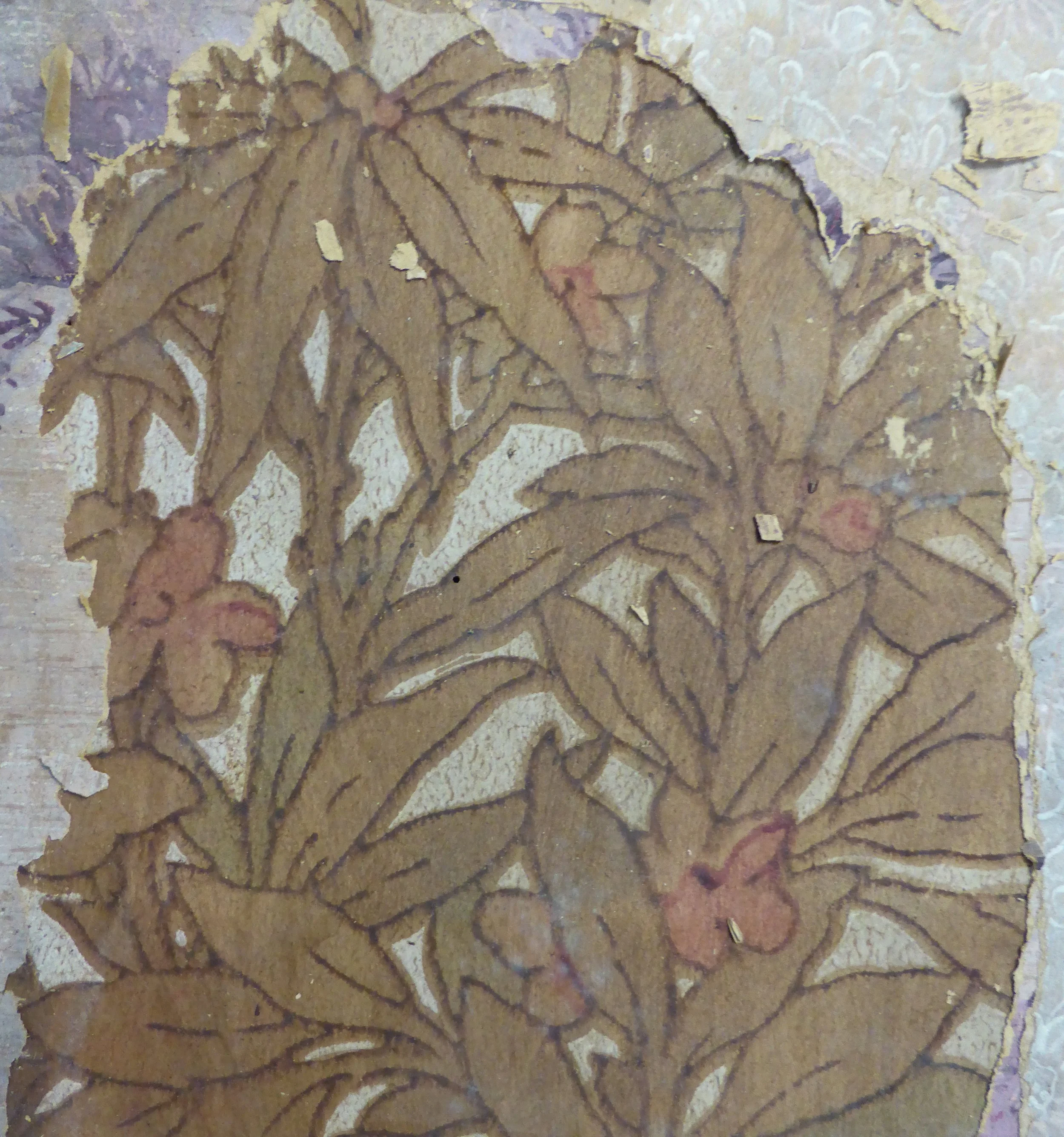 Wallpaper with foliage (greenish-brown) and flowers (reddish).