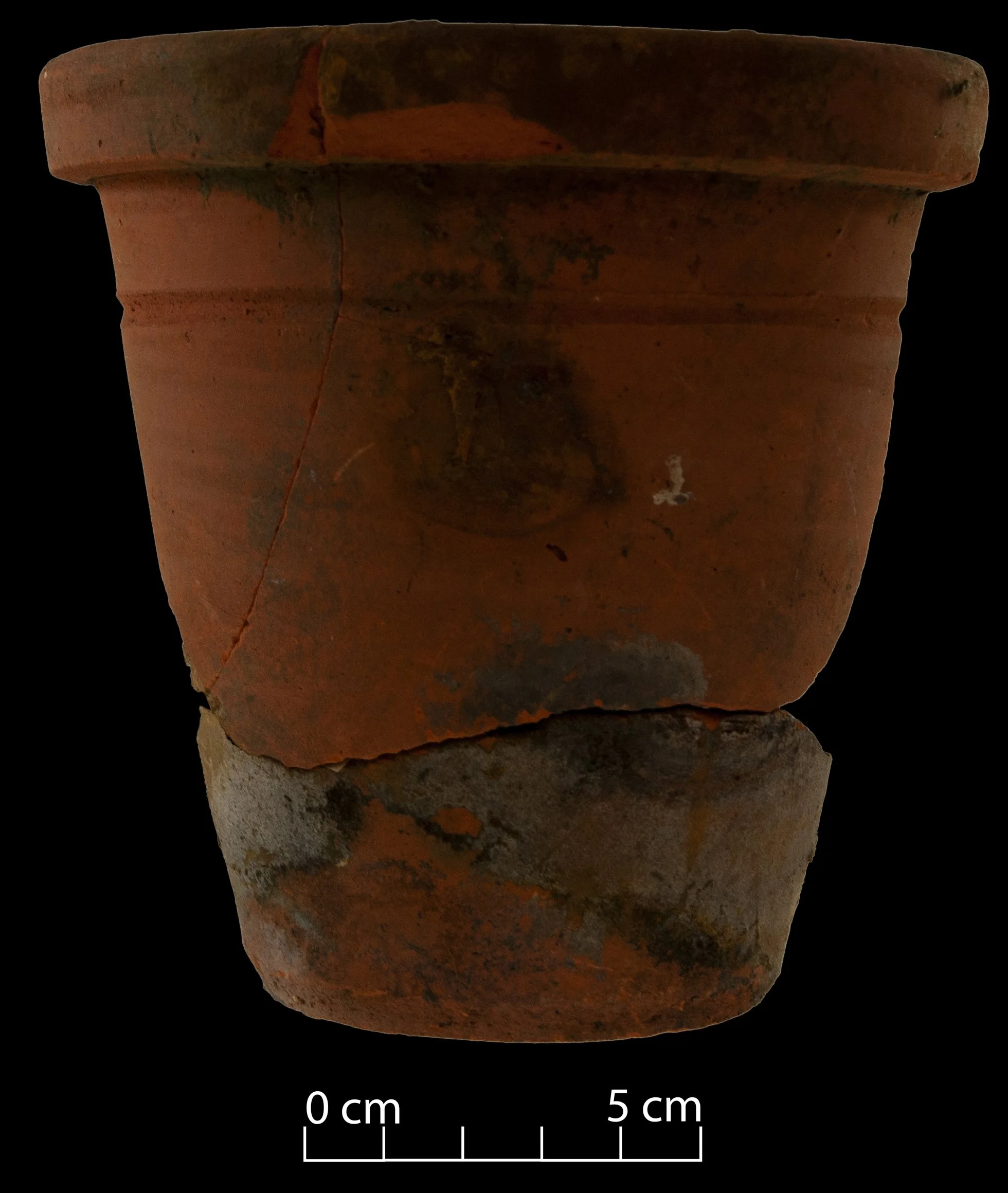 Terracotta flower pot, broken but complete.
