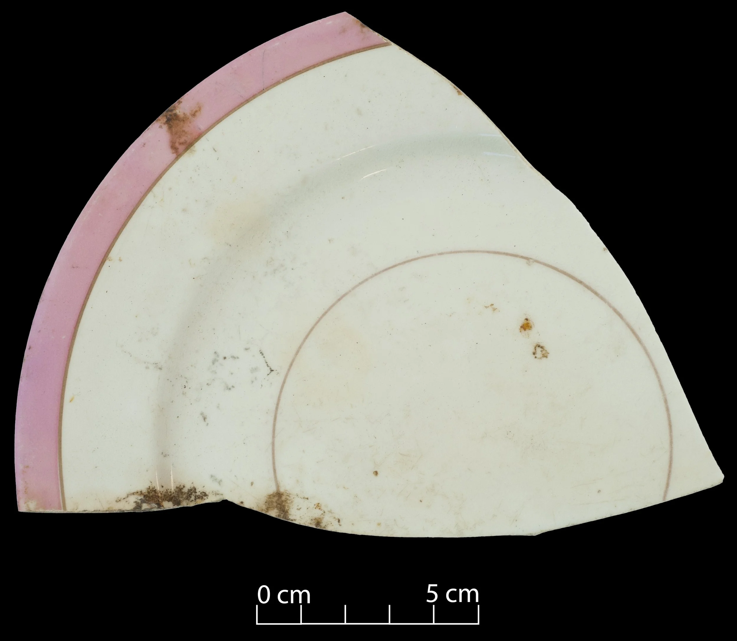Porcelain side plate. Gilt line and pink band decoration. Broken, incomplete.