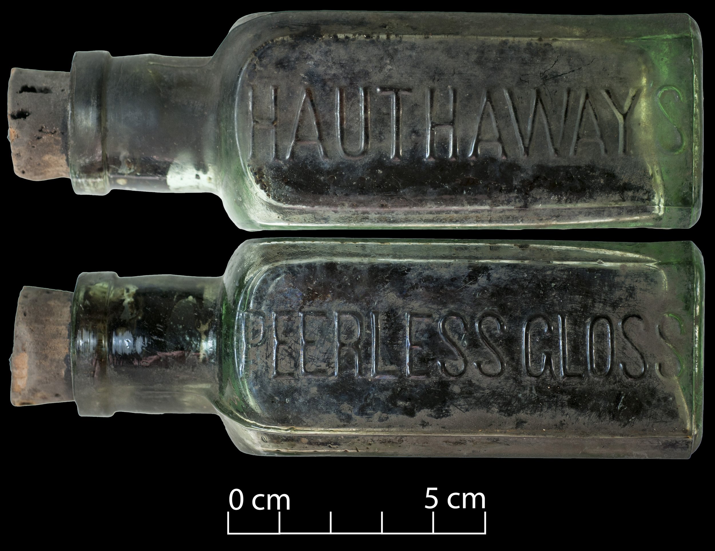 Hauthaway's peerless gloss bottle. Green aqua glass, cork in it. Embossed wiht "Hauthaway's" and "Peerless gloss"