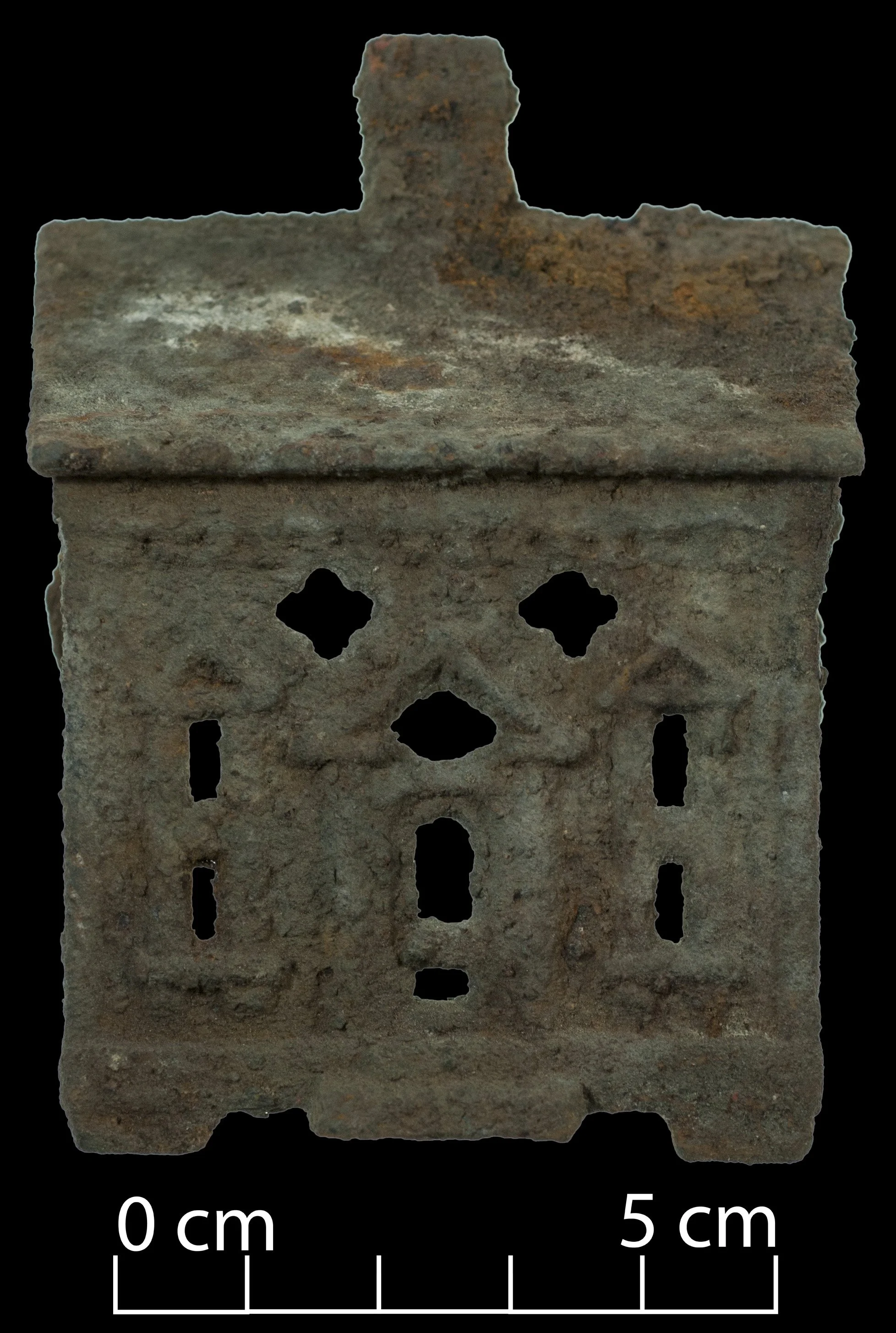Half of a ferrous money box, in the form of a house.