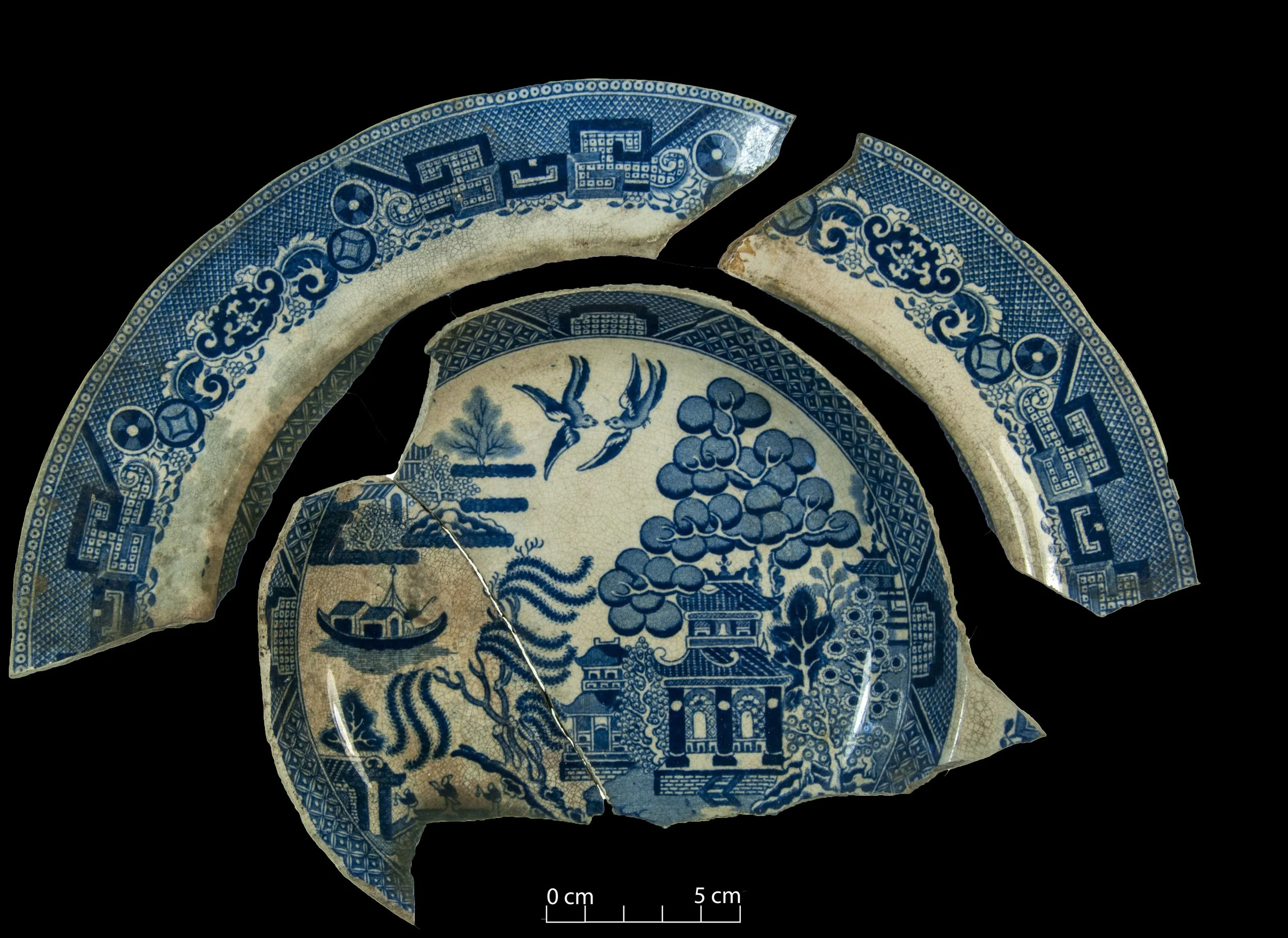 Willow soup plate. Broken, in three pieces.