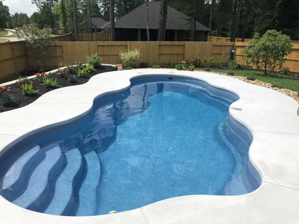 Clean residential swimming pool after weekly pool service
