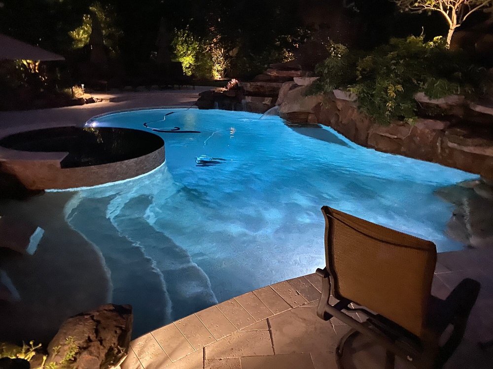 Pool at dusk with fire bowl
