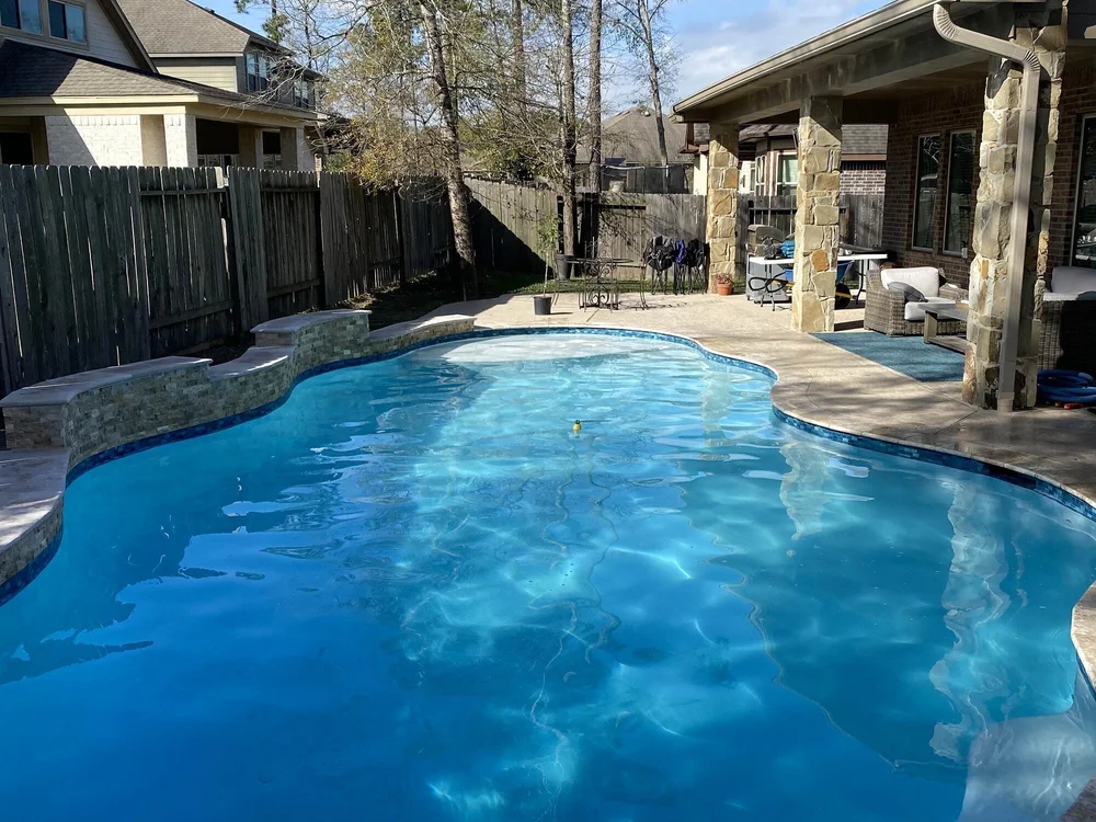 Clean blue backyard pool