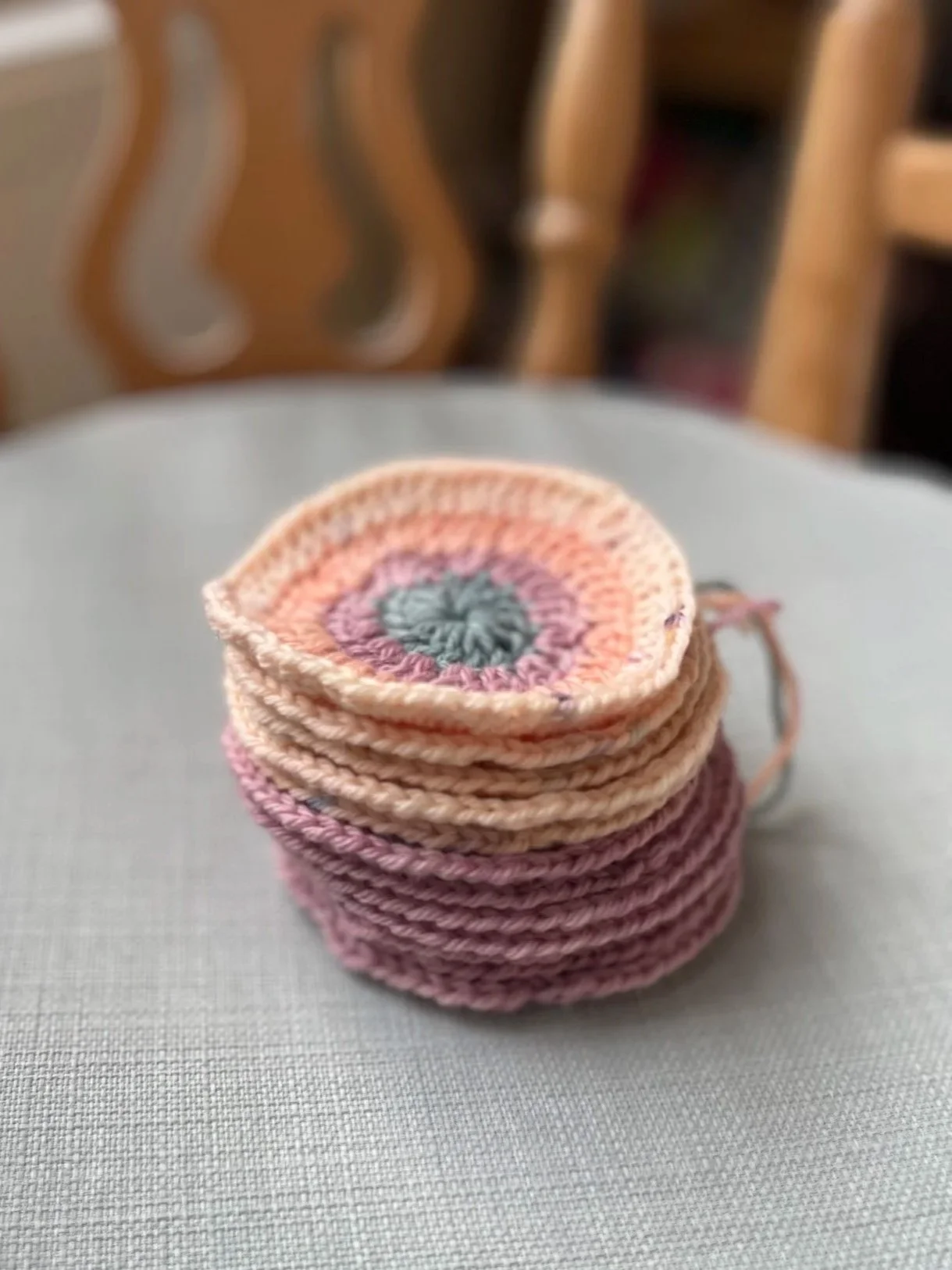 A stack of crocheted circles using botanically dyed wool