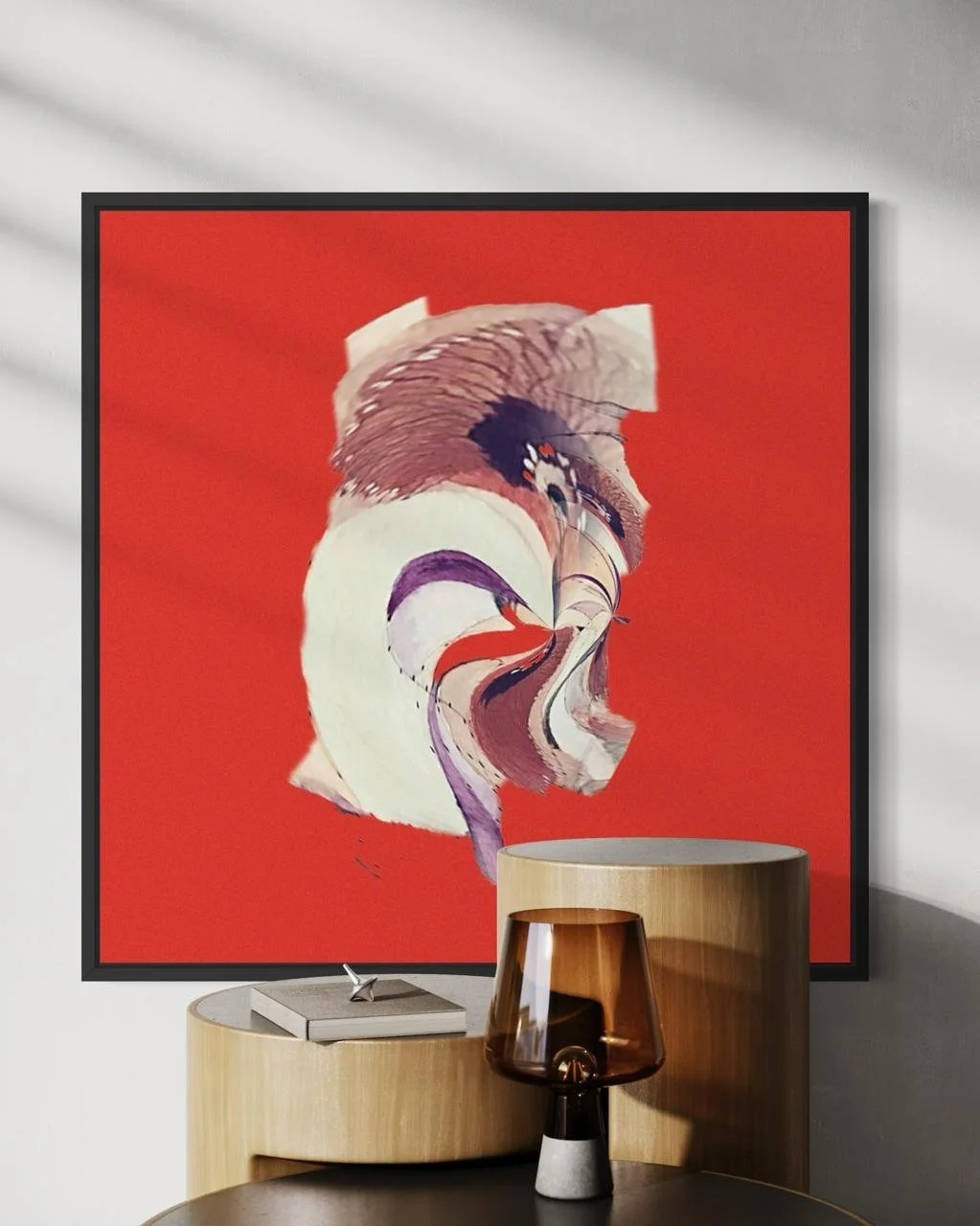 A modern room features a large red abstract portrait on the wall, with a wooden side table, a matching wooden chair, and a decorative lamp on the table.