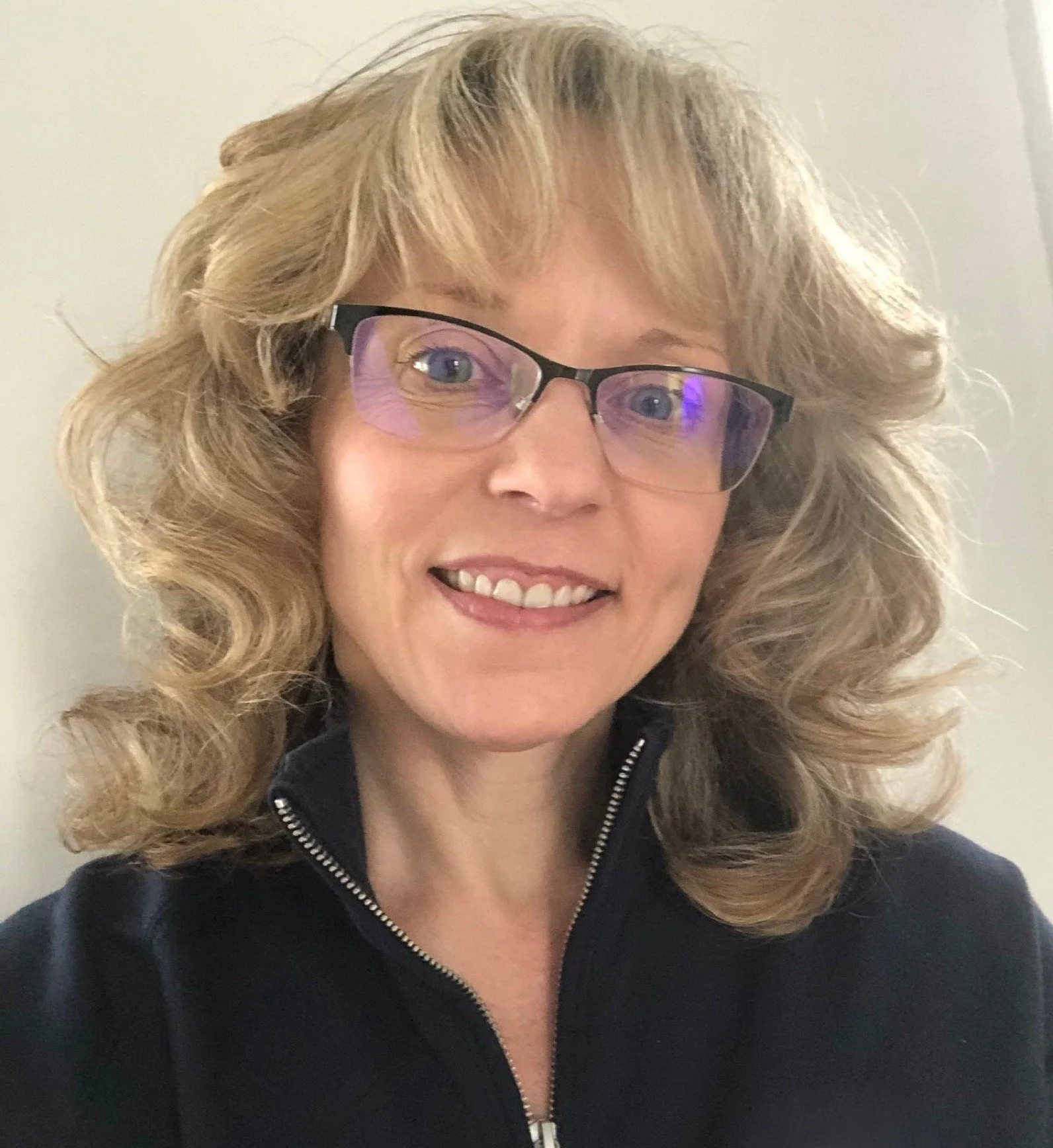 Image of Laura Delbrugge smiling.