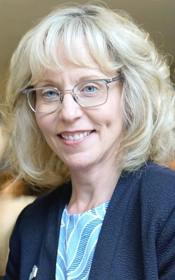 Image of Laura Delbrugge smiling.