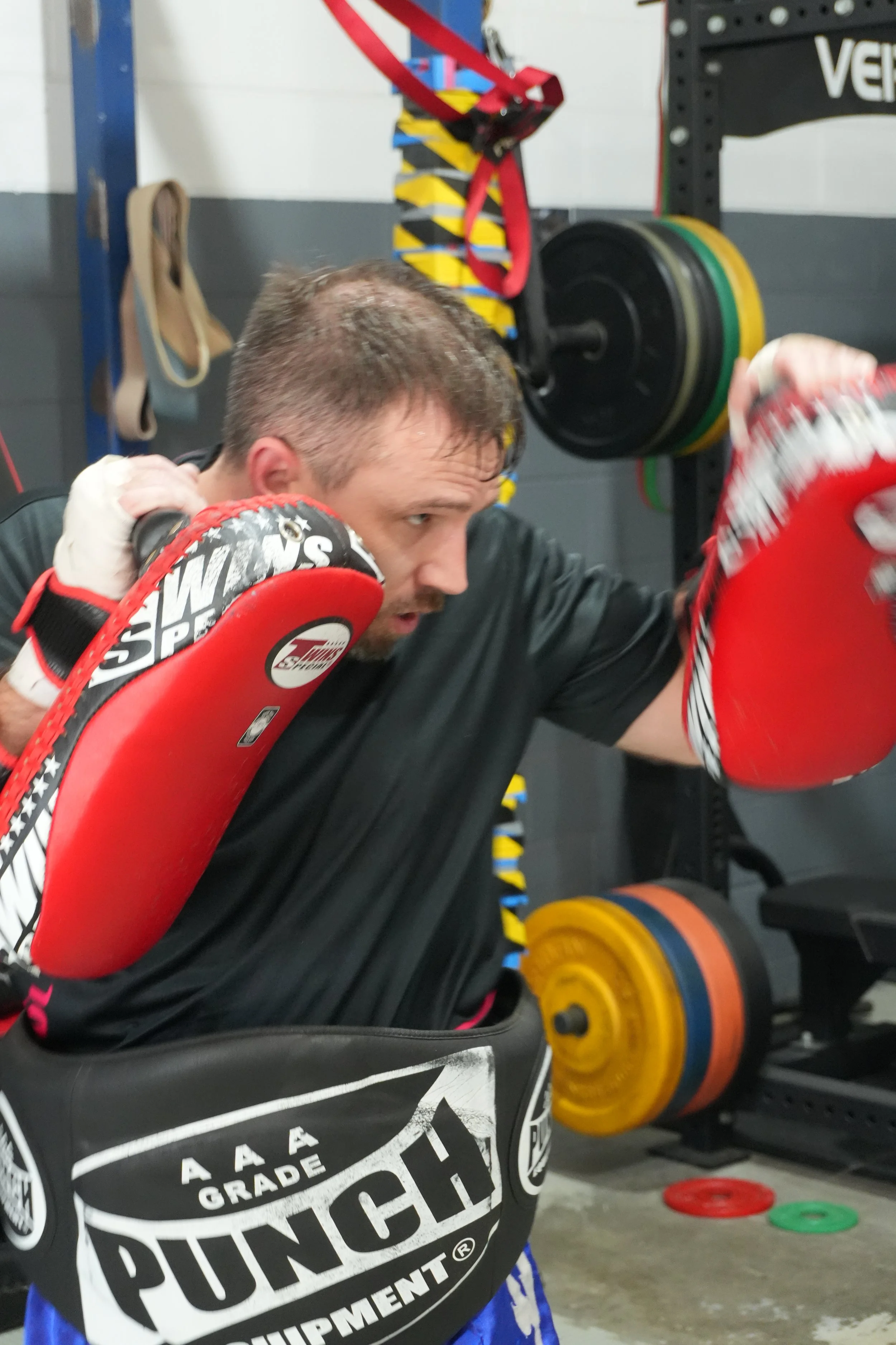 Partner drills on the Thai pads at DM Muay Thai & Fitness, Tweed Heads