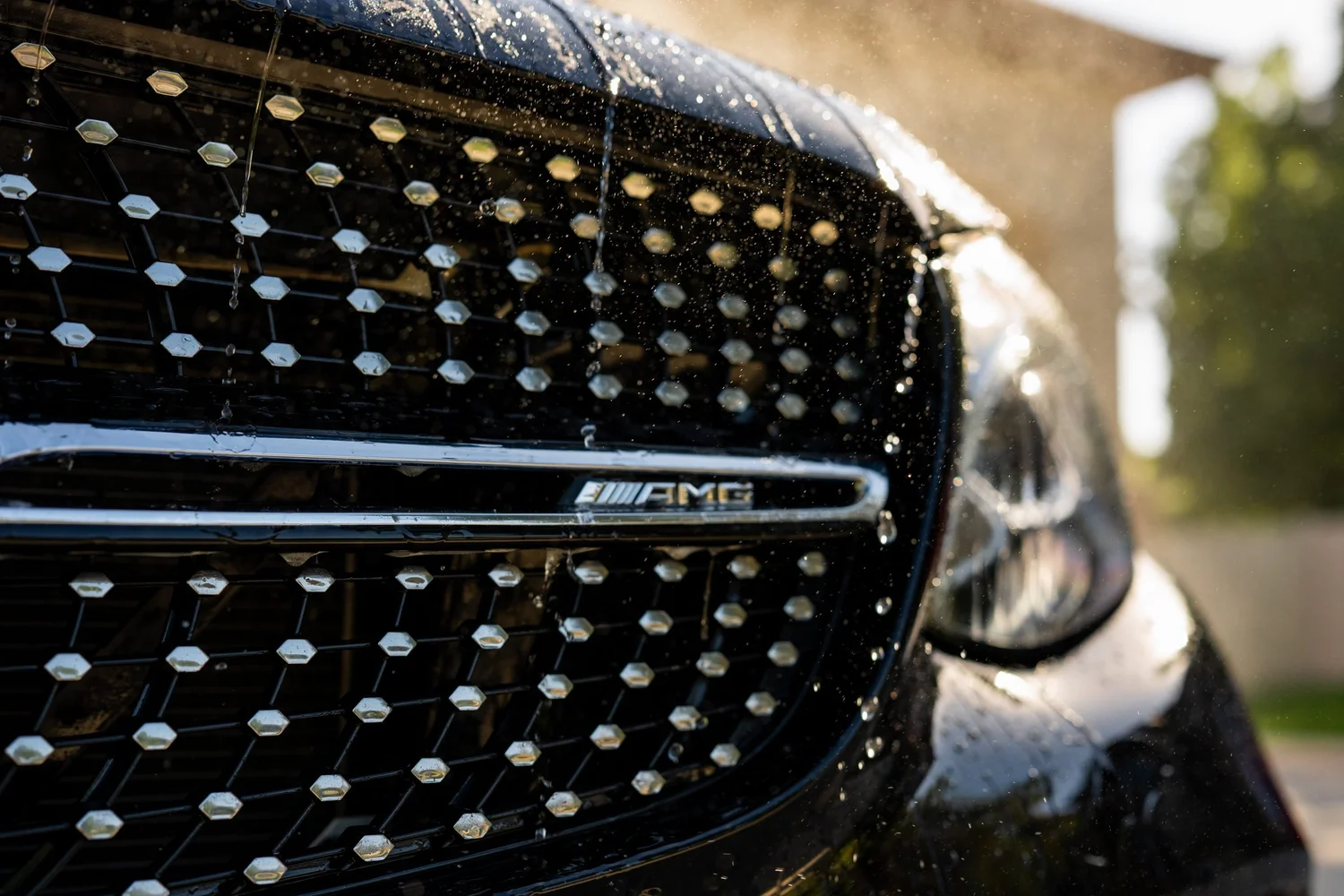 Water beads on a freshly coated Mercedes grille