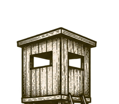 Wooden guard tower with small windows and stairs leading up to it.
