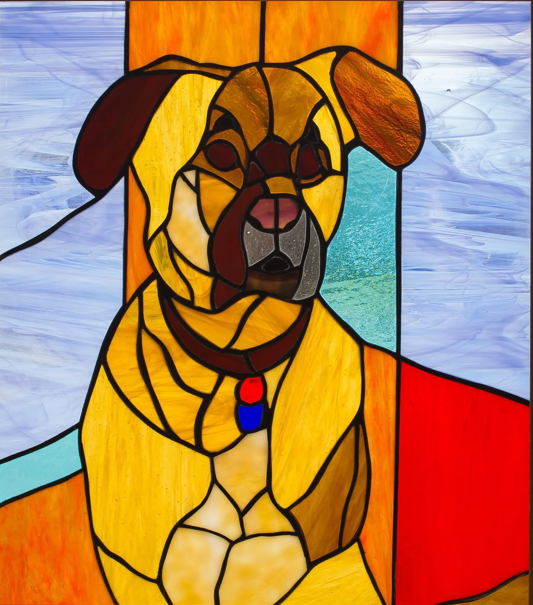 A stained-glass dog portrait in amber and brown against pale blue, orange, and red glass.