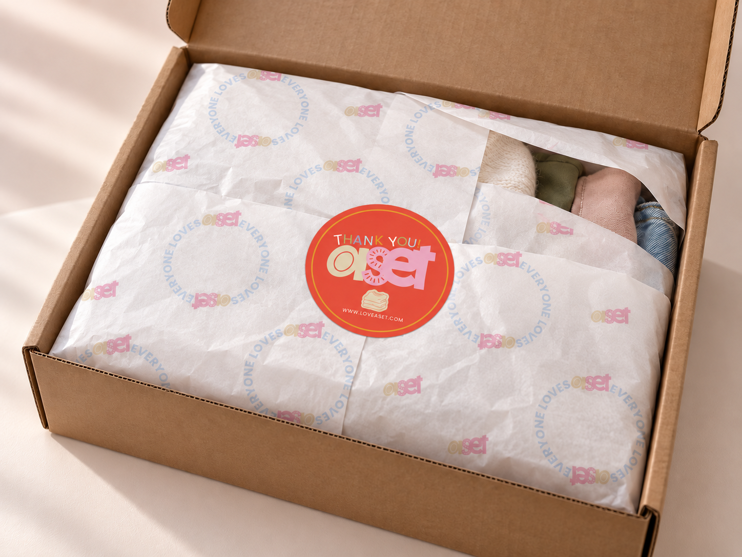 New thank-you sticker on tissue.png