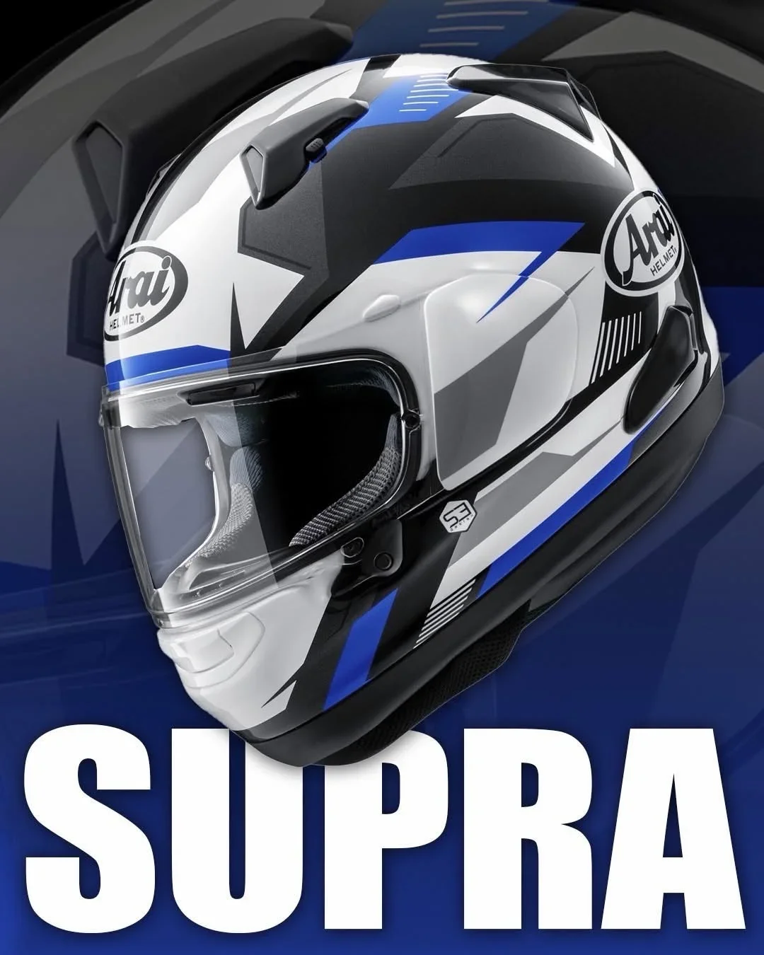 A professional motorcycle helmet with a white, black, and blue geometric design, displaying the brand Ari at the front and side, against a dark background with the word "SUPRA" in bold white letters.