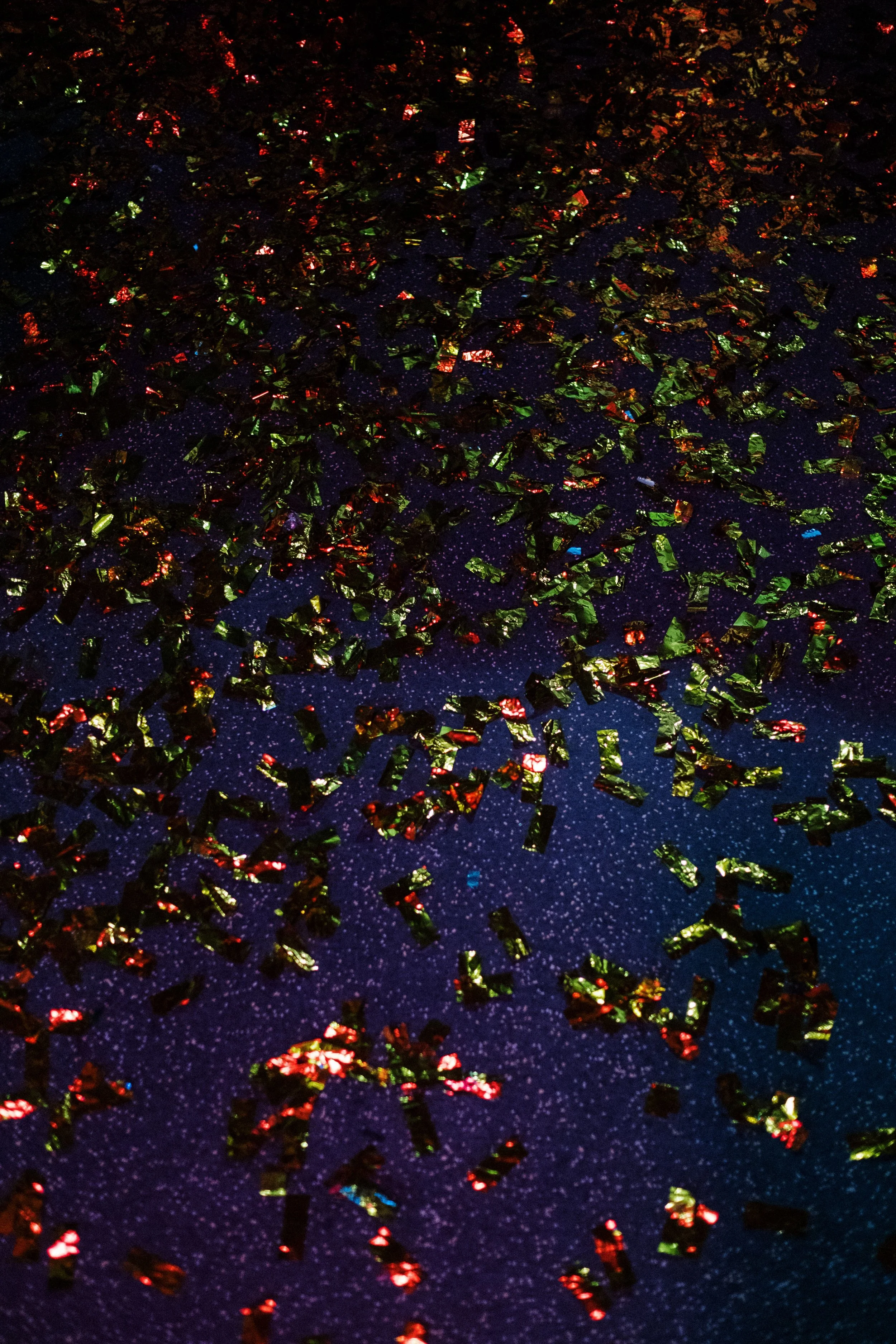 Confetti and colorful dance floor lighting, representing the energy PartyCrashers DJs creates