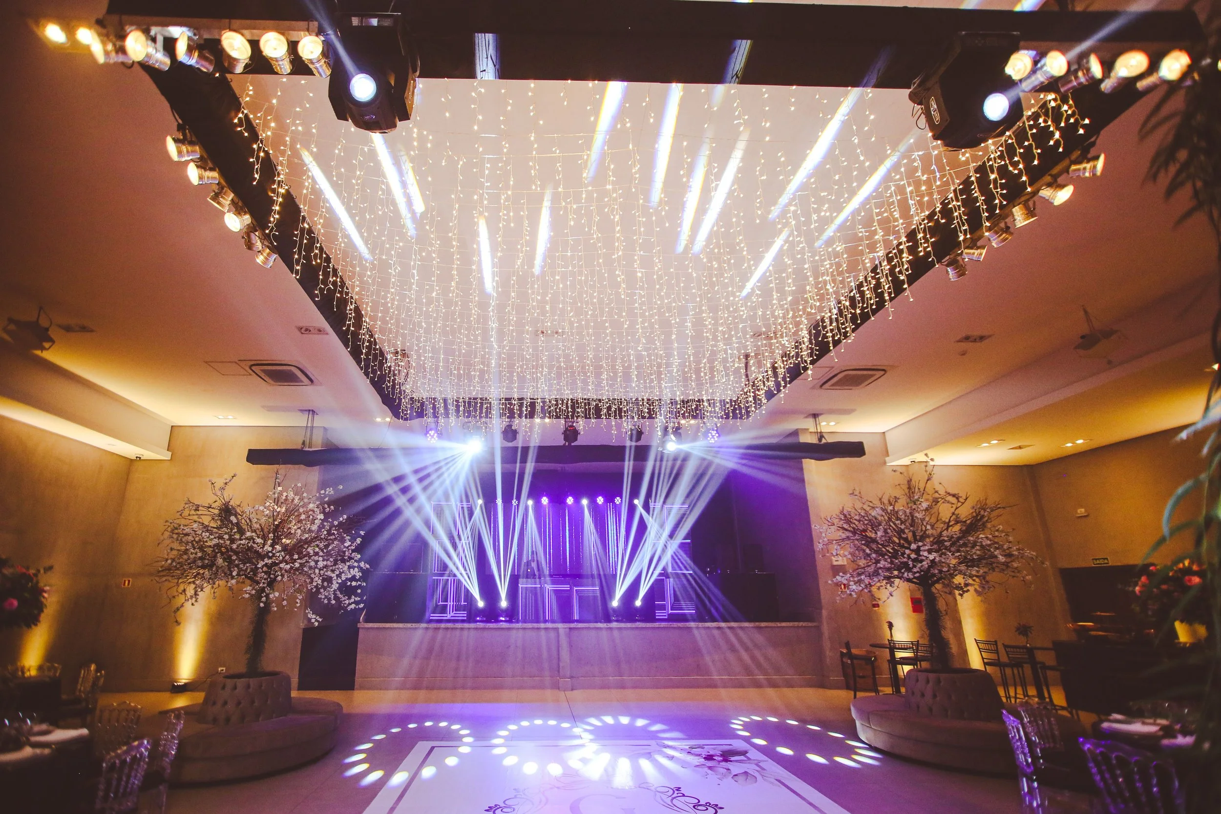 DJ booth and dance floor lighting setup by PartyCrashers DJs