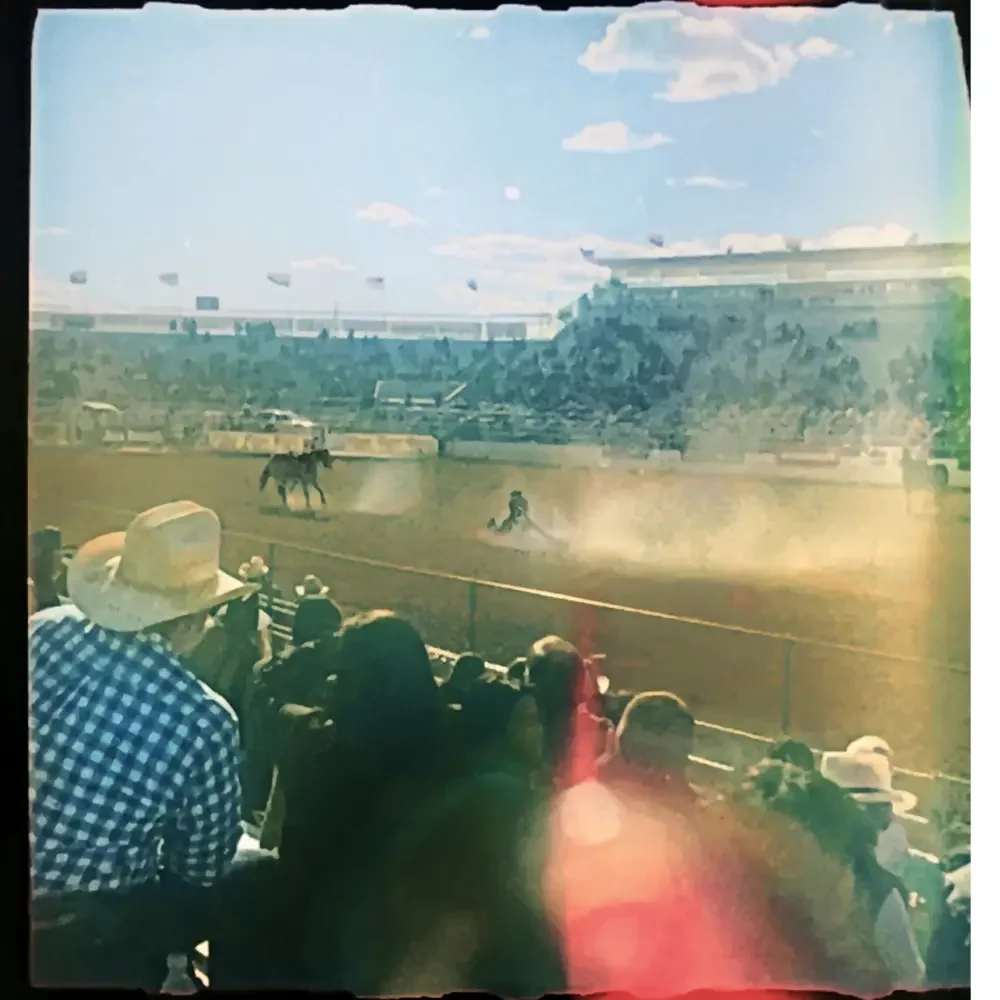 “The Calf Roper”
120 | Archival Print | Limited Edition (Signed)
16x24 in (vertical)

Captured on Kodak Portra 160 in Tucson, Arizona
The lines from a light leak, a dust cloud, and a lariat hold our calf and cowboy in tension as if suspended in the f