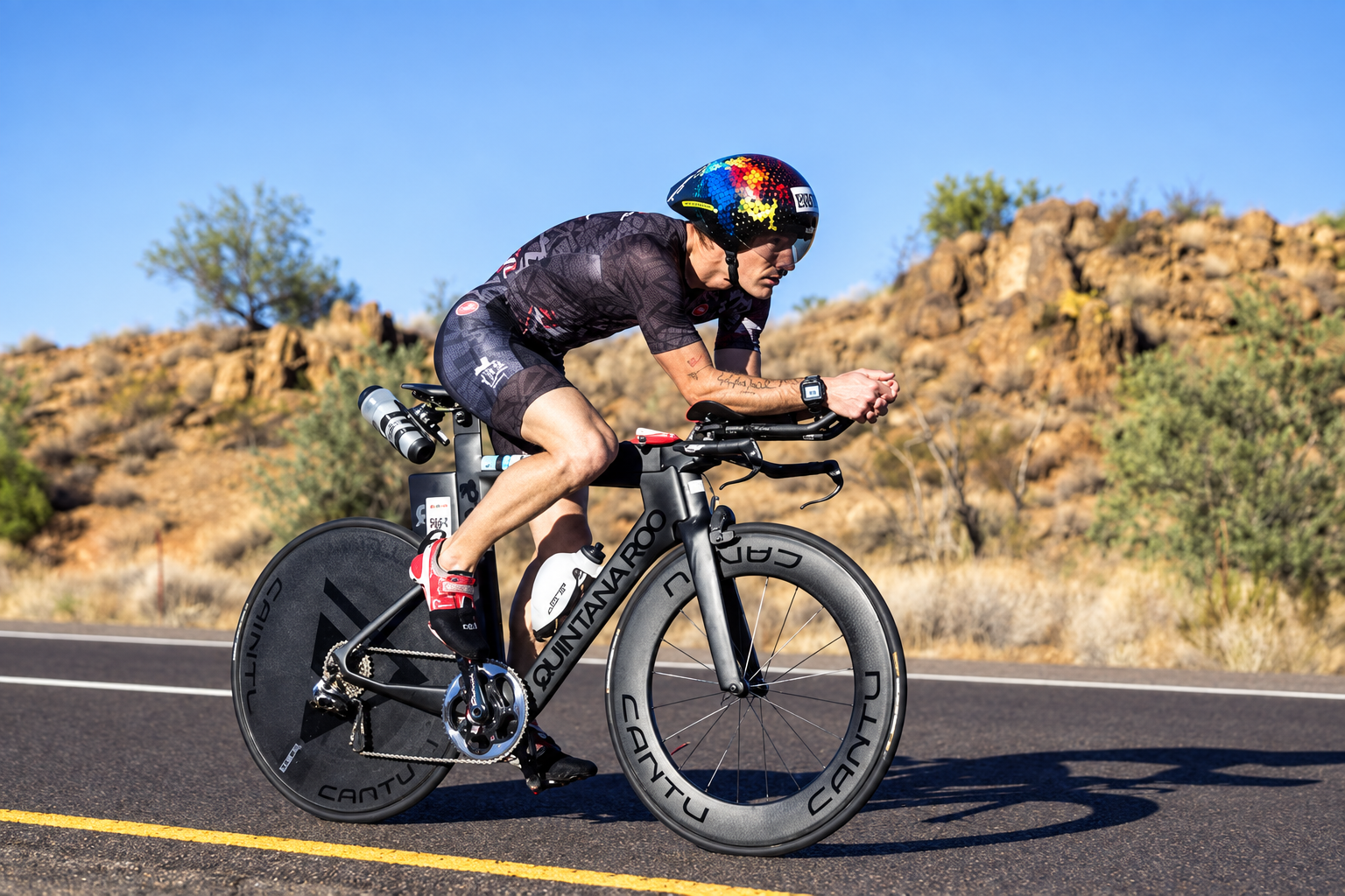 Coach Zach Miller racing the bike leg at IRONMAN Arizona, where he finished second in his age group.