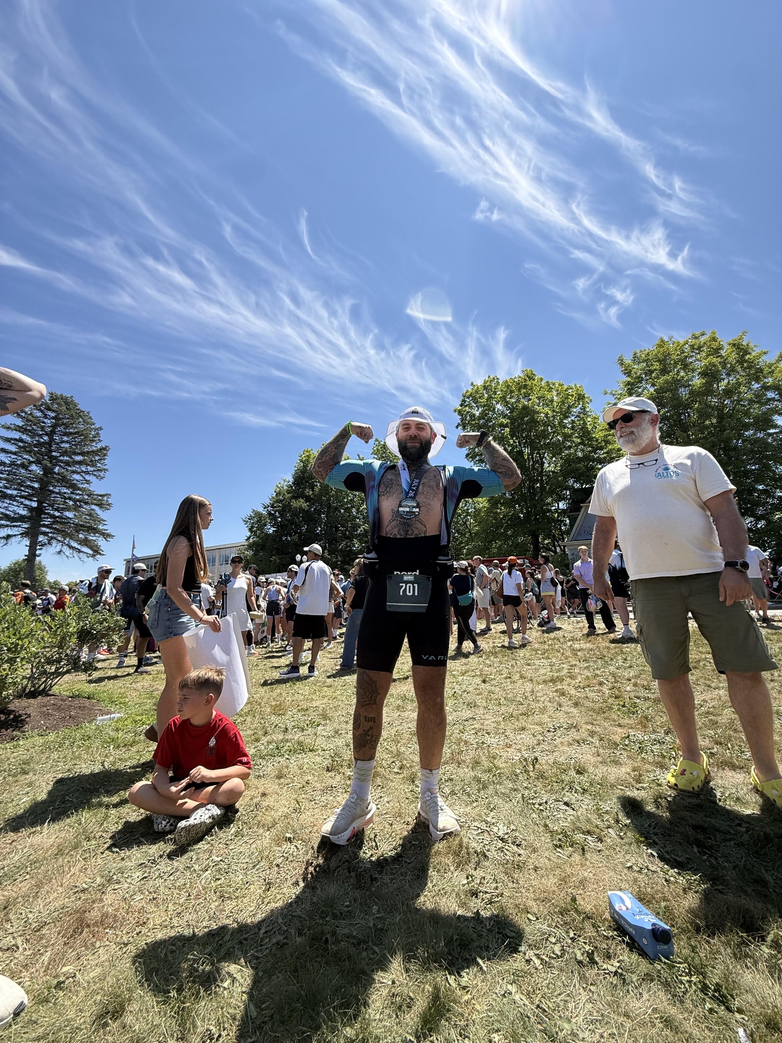 Nick celebrating after finishing IRONMAN 70.3 Maine.