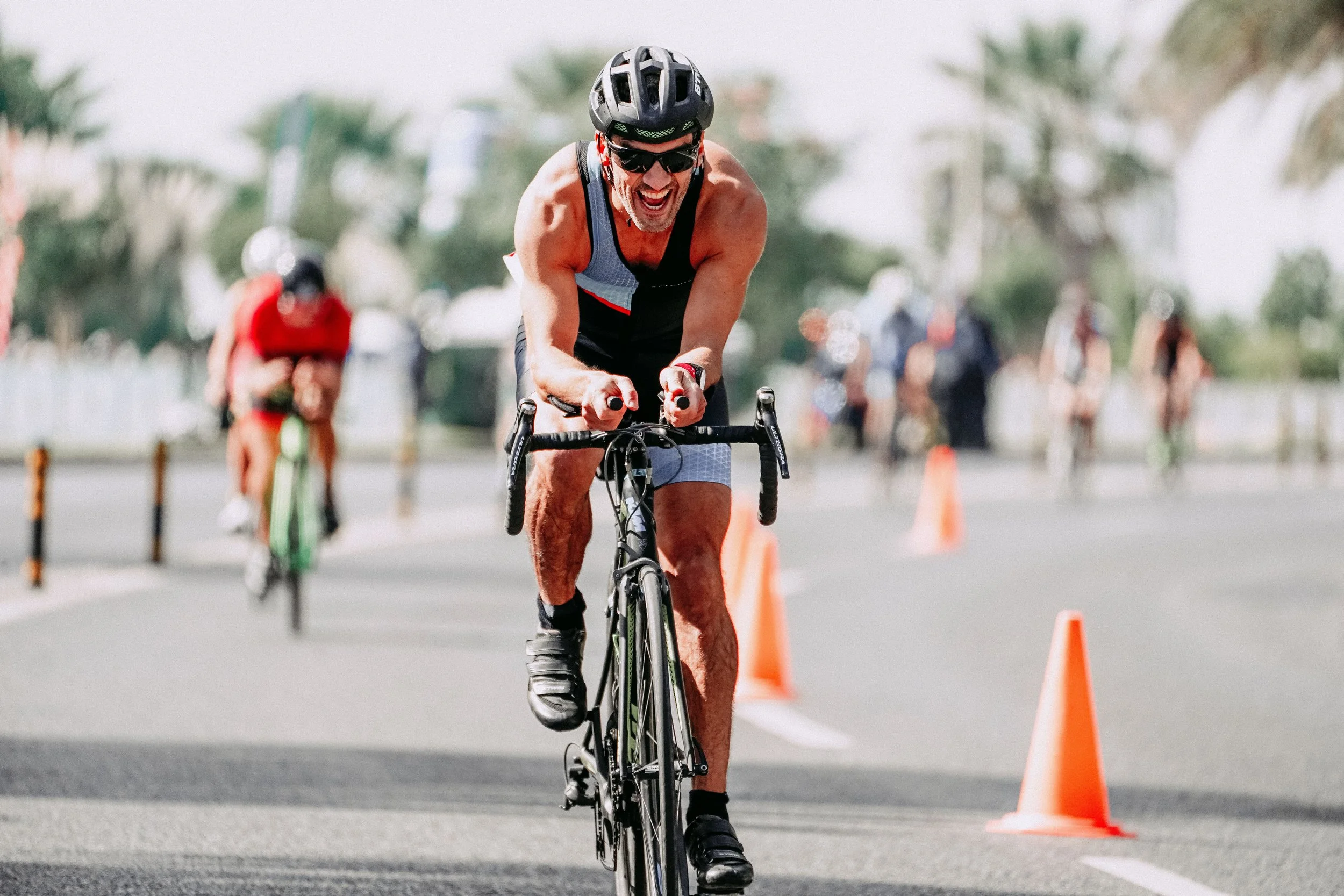 Triathlete racing on the bike course during a triathlon.